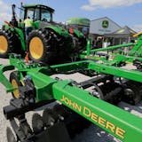 FILE - In this Sept. 10, 2019, file photo a John Deere tractor is on display at the Husker Harvest Days farm show in Grand Island, Neb. More than 10,000 Deere & Co. workers appear ready to go on strike if negotiators can't deliver a new agreement by the end of Wednesday, Oct. 13, 2021. (AP Photo/Nati Harnik, File)