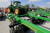 FILE - In this Sept. 10, 2019, file photo a John Deere tractor is on display at the Husker Harvest Days farm show in Grand Island, Neb. More than 10,000 Deere &amp; Co. workers appear ready to go on strike if negotiators can't deliver a new agreement by the end of Wednesday, Oct. 13, 2021. (AP Photo/Nati Harnik, File)