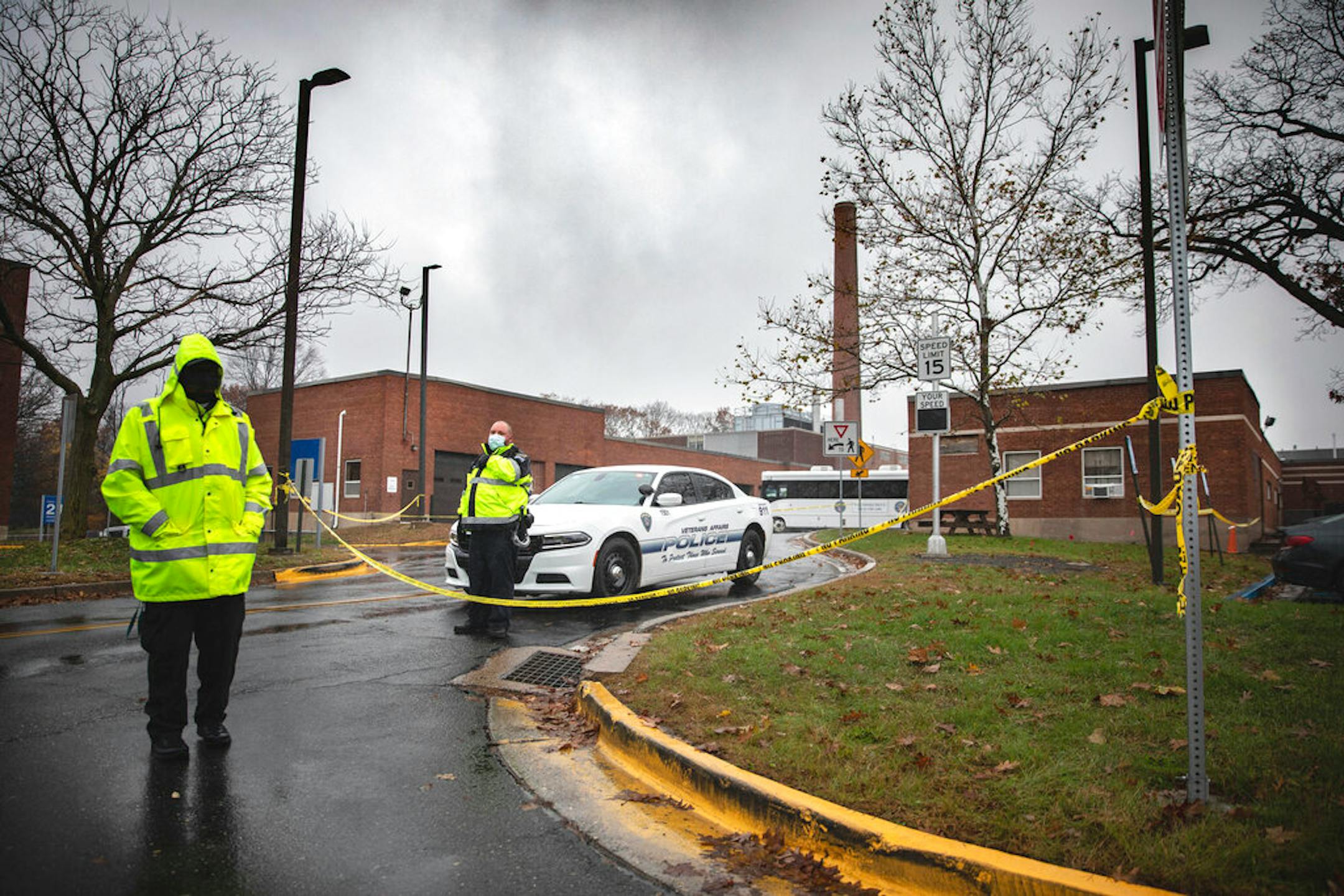 Veterans Affairs Police guard the entrance to a maintenance facility after an apparent steam explosion in a maintenance building at a Veterans Affairs hospital in West Haven, Conn., Friday, Nov. 13, 2020. (AP Photo/Robert Bumsted)