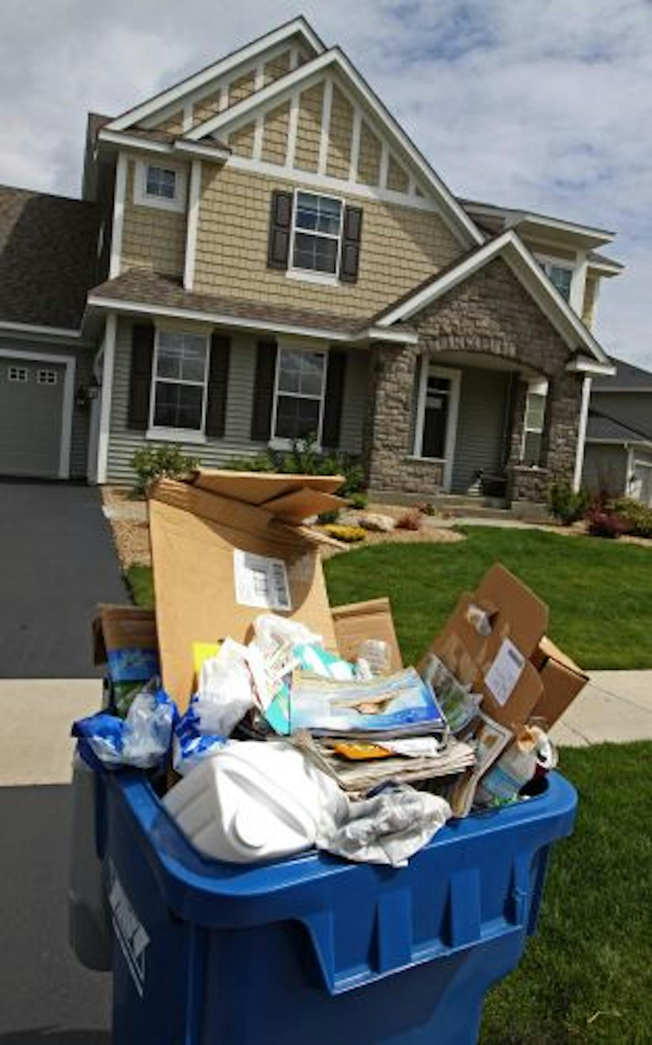 Co-mingled recycling waited to be picked-up by Allied Waste Services near the intersection of Urbandale Lane North and 62nd Place North in Maple Grove.