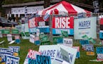 Democratic presidential candidates' campaign signs at the Polk County Democrats' annual Steak Fry in Des Moines, Iowa, on Saturday, Sept. 21, 2019. (H