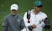 Jordan Spieth walks with his caddie on the driving range during a practice round for the Masters golf tournament Tuesday, April 8, 2014, in Augusta, G