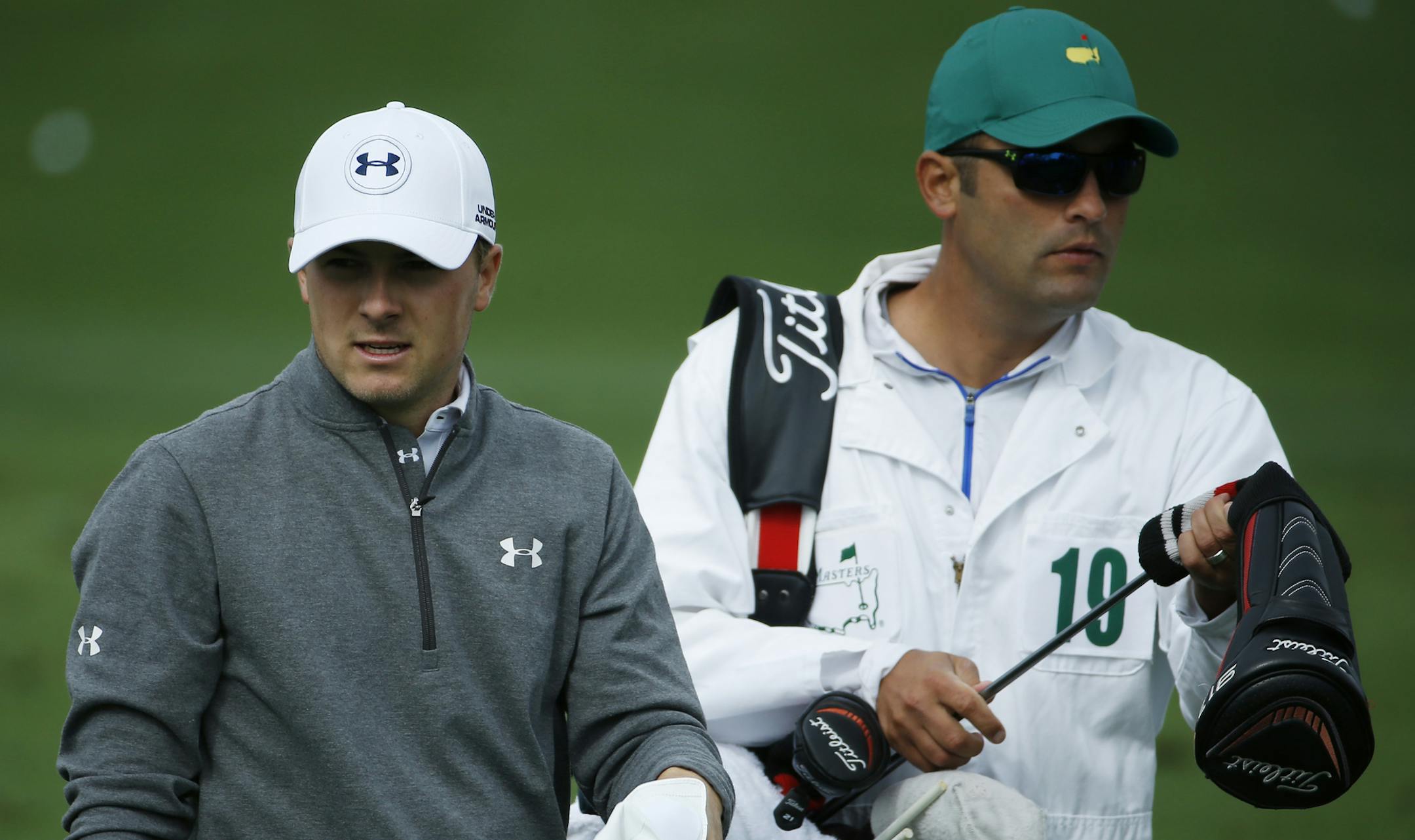 Jordan Spieth walks with his caddie on the driving range during a practice round for the Masters golf tournament Tuesday, April 8, 2014, in Augusta, Ga. (AP Photo/Matt Slocum)