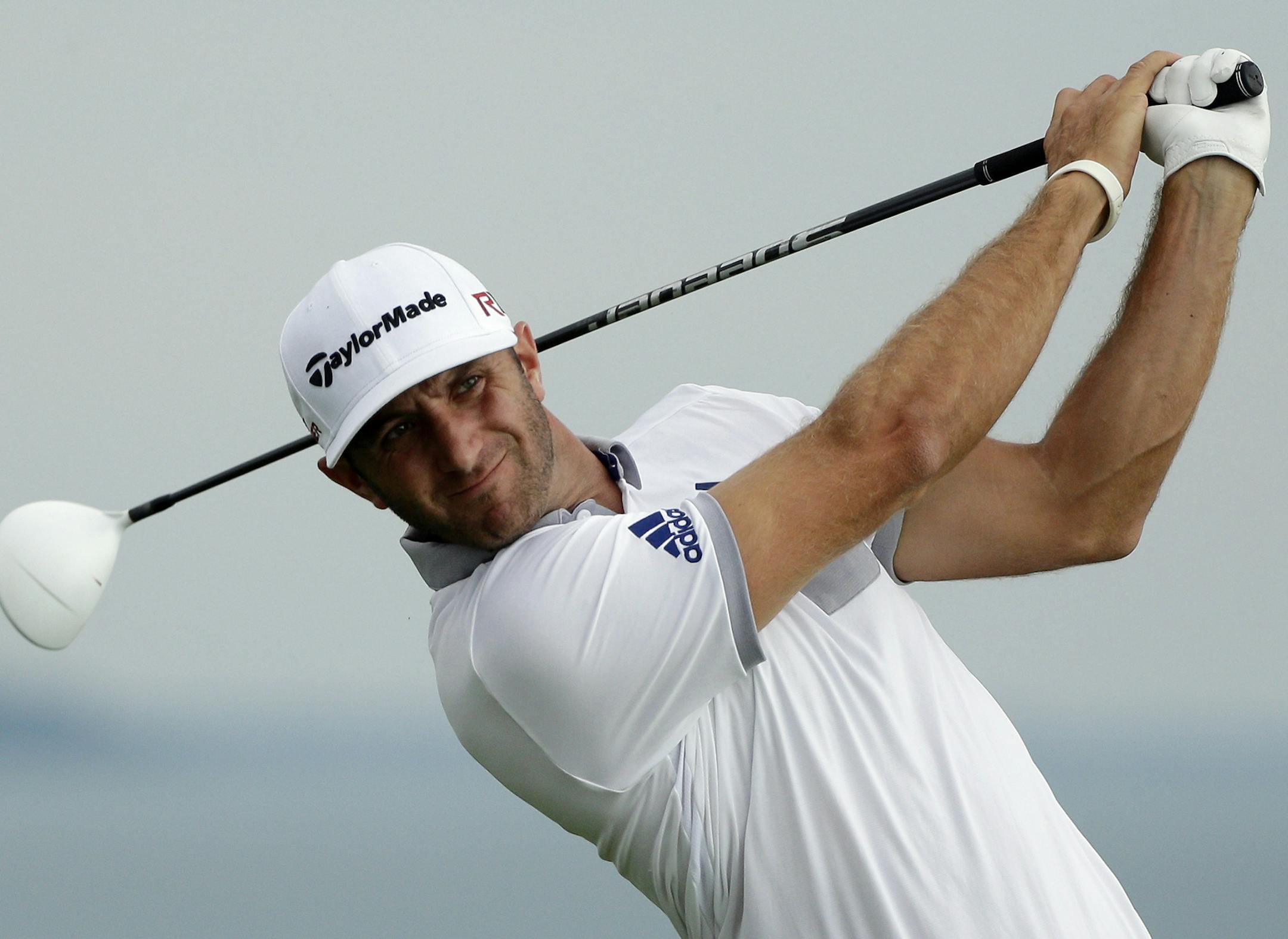Dustin Johnson hits a drive on the 16th hole during the first round of the PGA Championship golf tournament Thursday, Aug. 13, 2015, at Whistling Straits in Haven, Wis. (AP Photo/Jae Hong)