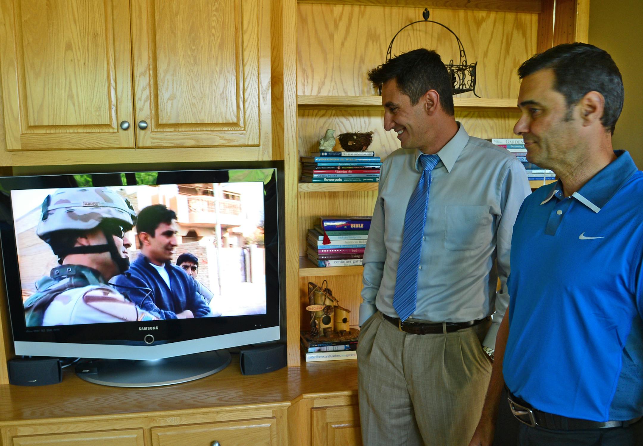 Michael Baumann is a retired Lt. Col. in the Army who was a commander in Iraq. Fadhil was his interpreter. Baumann worked to get Fadhil, who was known as Freddie, to the US where he became an American citizen last year. The two got together to remember their Iraq experiences looking over a documentary project that was produced on Bauman's unit.Richard.Sennott@startribune.com Richard Sennott/Star Tribune Lakeville Minn. Friday 6/20/2014) ** (cq)