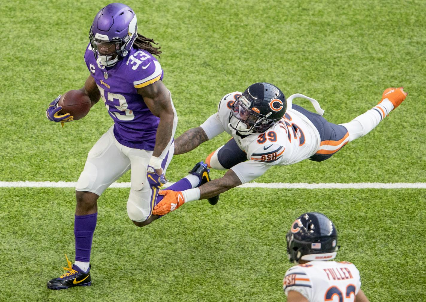 Minnesota Vikings running back Dalvin Cook (33) was chased by Eddie Jackson (39) of the Chicago Bears in the second quarter.