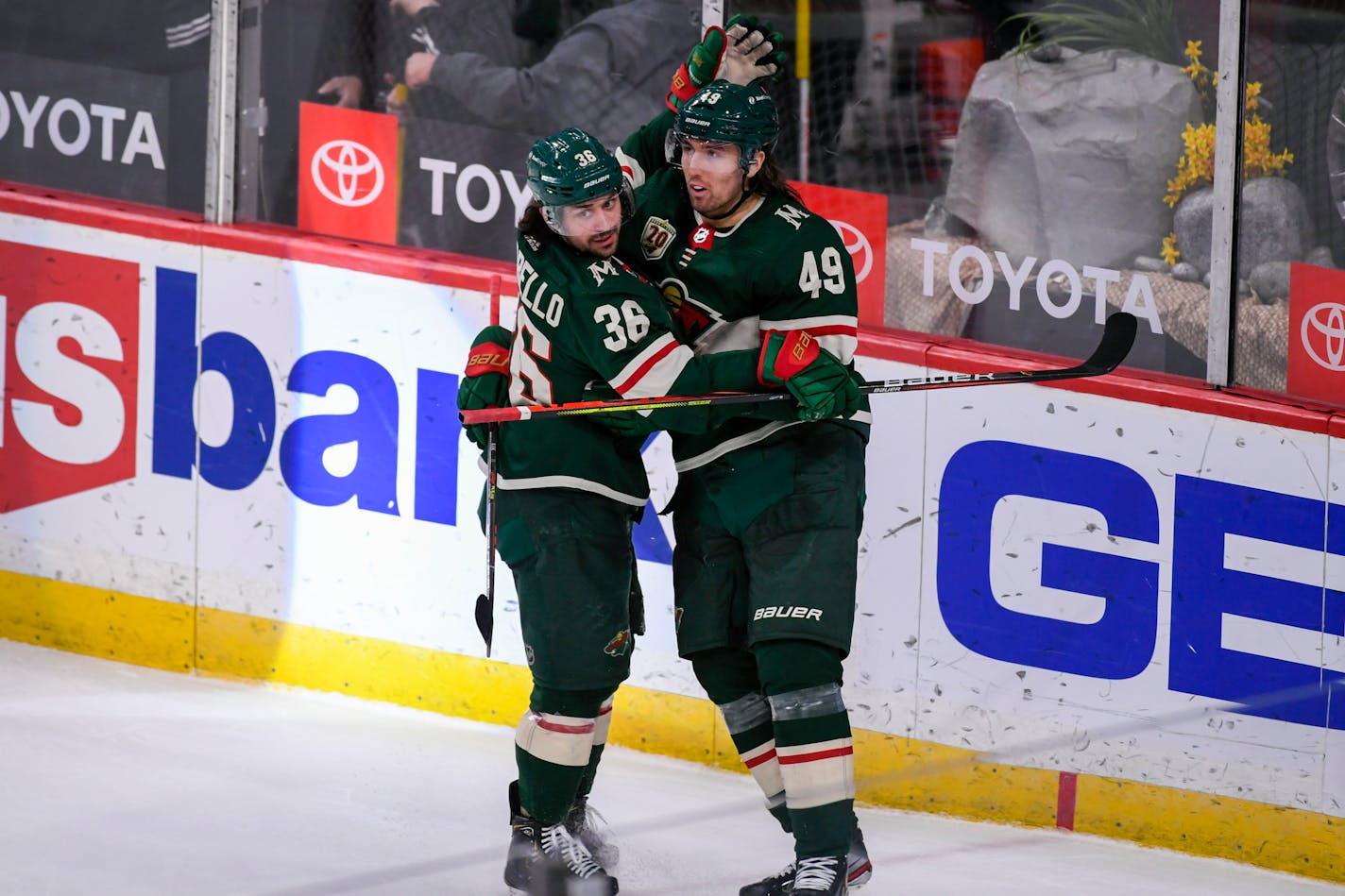 Minnesota Wild center Victor Rask (49) celebrates with right wing Mats Zuccarello(36) after Rask scored against the Anaheim Ducks during overtime in an NHL hockey game Saturday, May 8, 2021, in St. Paul, Minn. The Wild won 4-3. (AP Photo/Craig Lassig)