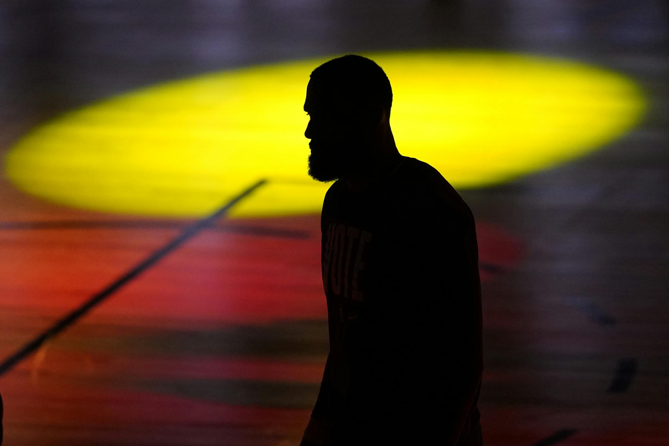 Los Angeles Lakers' LeBron James (23) is seen silhouetted during introductions prior to Game 6 of basketball's NBA Finals against the Miami Heat Sunday, Oct. 11, 2020, in Lake Buena Vista, Fla. (AP Photo/Mark J. Terrill)