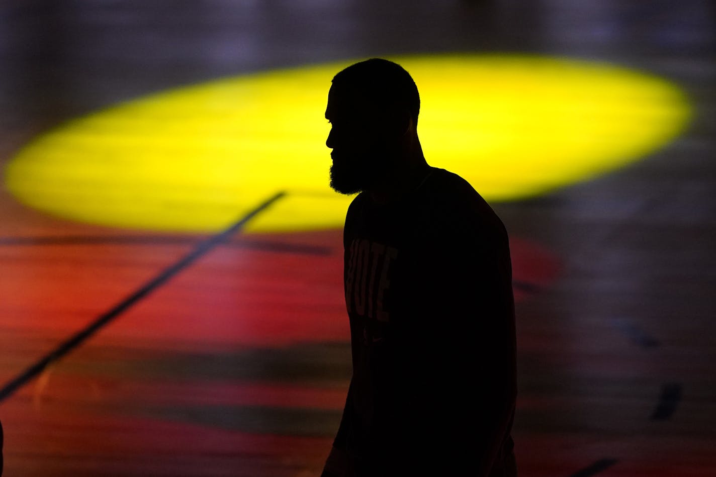 Los Angeles Lakers' LeBron James (23) is seen silhouetted during introductions prior to Game 6 of basketball's NBA Finals against the Miami Heat Sunday, Oct. 11, 2020, in Lake Buena Vista, Fla. (AP Photo/Mark J. Terrill)