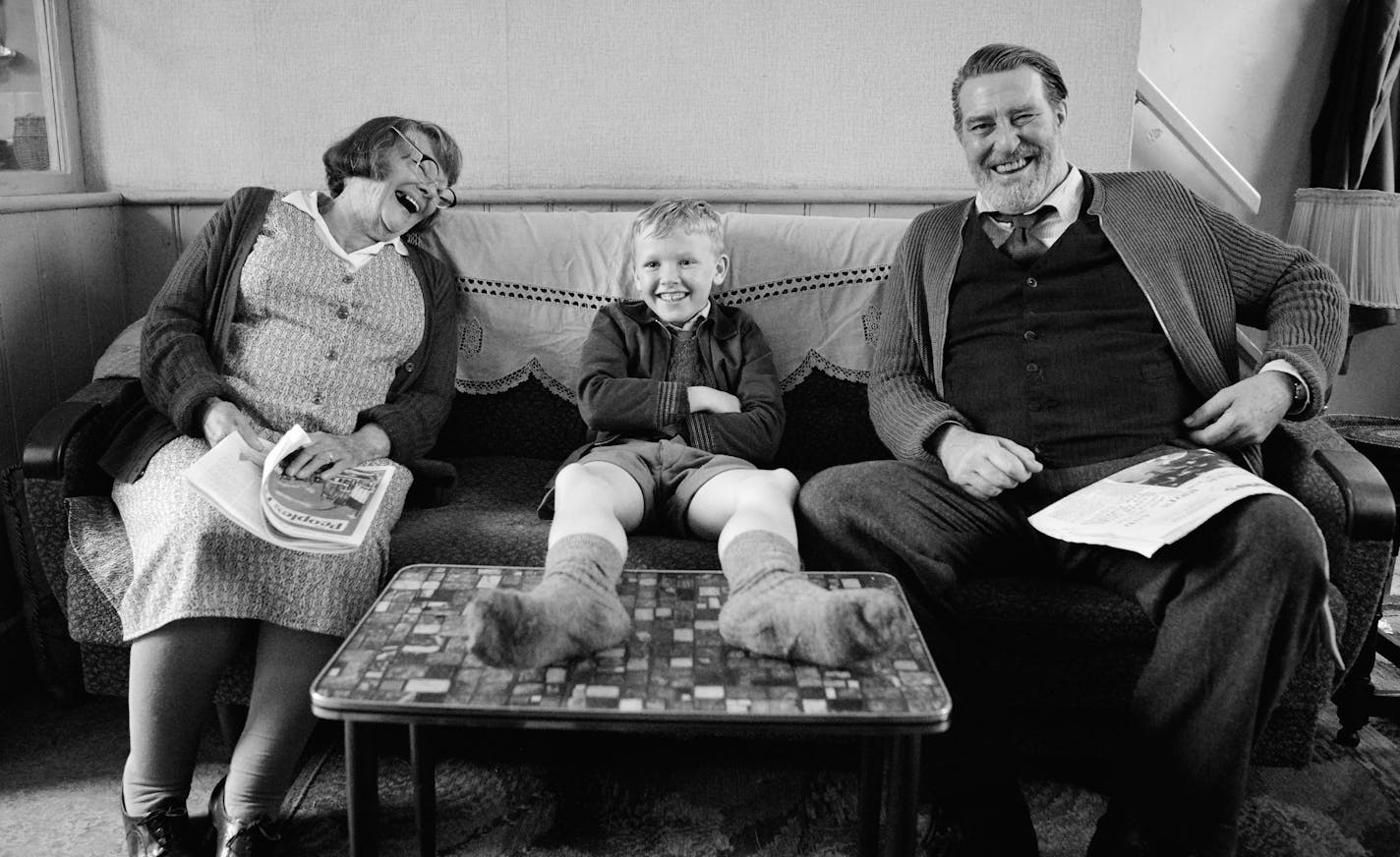 Judi Dench, from left, Jude Hill and Ciarán Hinds appear in a scene from "Belfast." (Rob Youngson/Focus Features via AP)