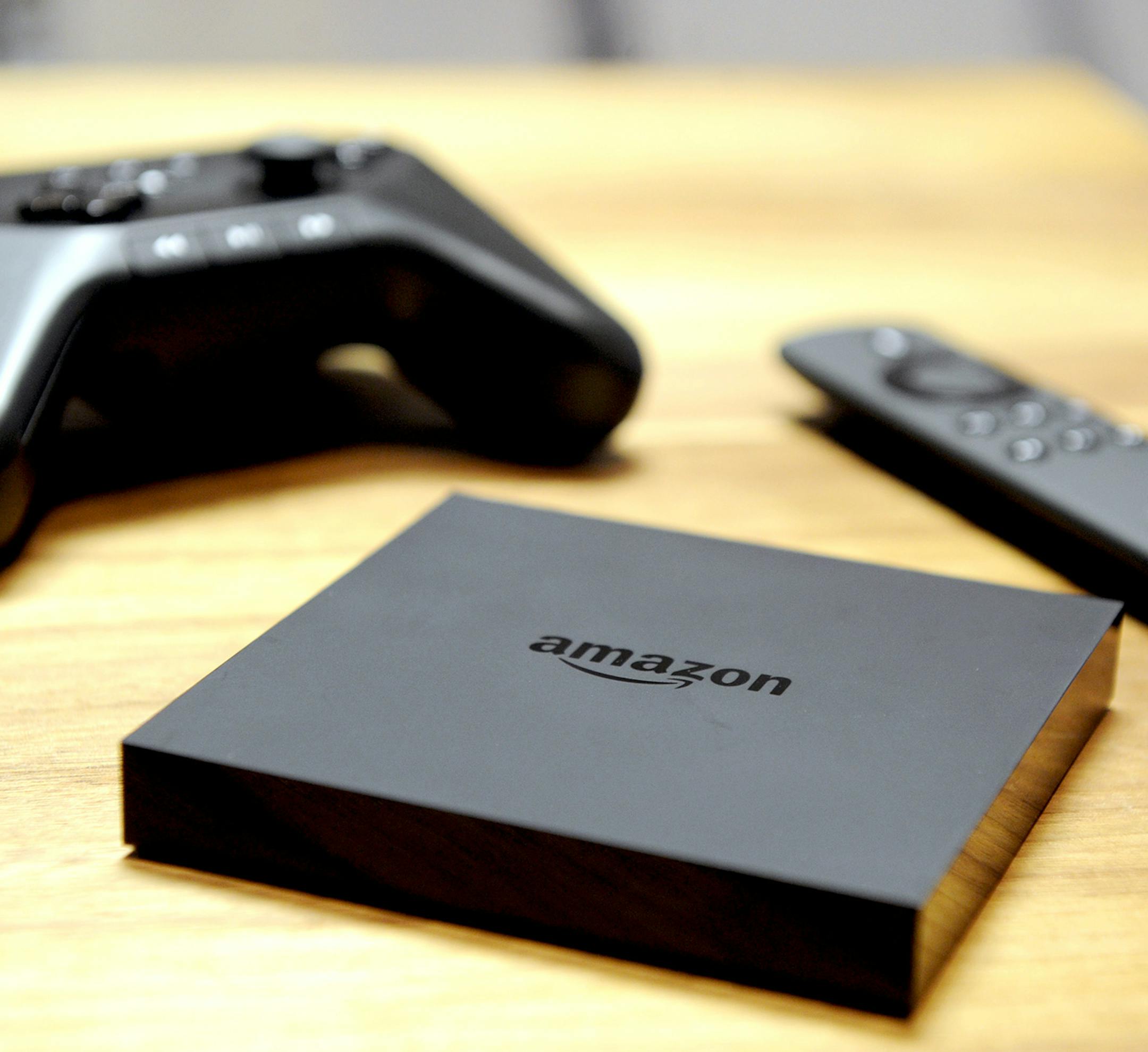 IMAGE DISTRIBUTED FOR AMAZON - Amazon Fire TV is unveiled during a press conference in New York, Wednesday, April 2, 2014. At $99, Amazon Fire TV is the easiest way to watch Netflix, Prime Instant Video, Hulu Plus, WatchESPN, and more on your big-screen TV. (Photo by Diane Bondareff/Invision for Amazon/AP Images) ORG XMIT: INVL