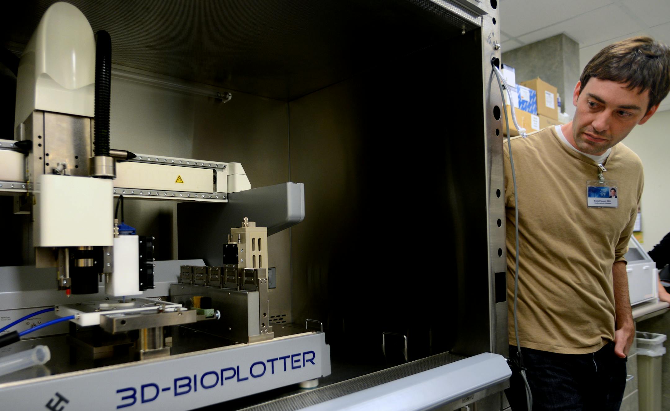 Physicians and researchers at the Mayo Clinic in Rochester say they see the future of medicine: a smorgasbord of technology that can be used to tap the body's innate ability to heal itself. Dr Daniel Spoon is working with a bioreactor and a bioprinter with which he hopes to print heart valves. Dr Daniel Spoon looks at a bioprinter in his lab area. ] Richard.Sennott@startribune.com Richard Sennott/Star Tribune Rochester Minnesota Wednesday 6/5/13) ** (cq)