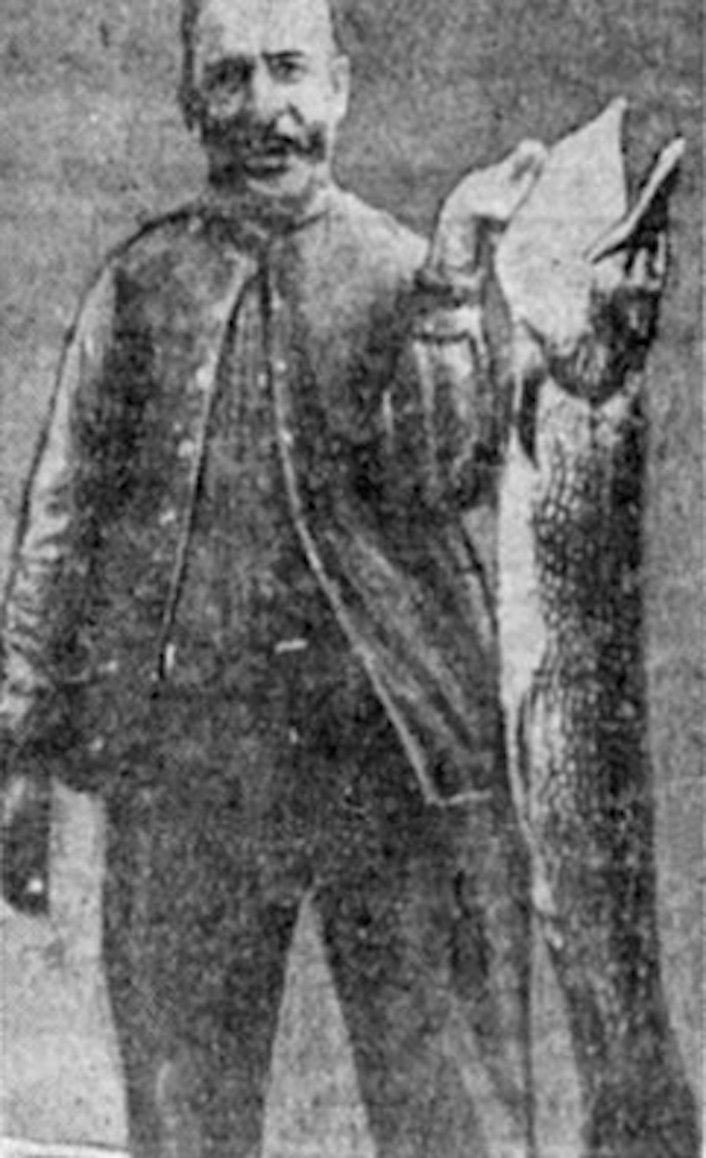 Full photo of J.V. Schanken, then of Chicago, said to be with the record Minnesota northern pike, weighing 45 pounds, 12 ounces.