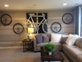 The family TV room has moved out of the basement and upstairs next to the kids' bedrooms, including this bike-themed getaway space. (#303, Pulte Homes