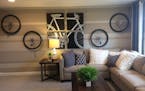 The family TV room has moved out of the basement and upstairs next to the kids' bedrooms, including this bike-themed getaway space. (#303, Pulte Homes