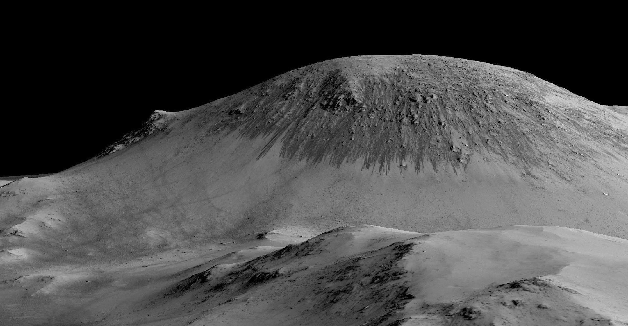 In an undated handout photo, satellite images combined with elevation data give the impression of the height of a slope in Horowitz Crater on Mars lined with dark streaks 100 yards long. Scientists reported on Monday definitive signs of liquid water on the surface of present-day Mars, a finding that will fuel speculation that life, if it ever arose there, could persist to now. (NASA/Jet Propulsion Laboratory/University of Arizona) -- NO SALES; FOR EDITORIAL USE ONLY WITH STORY SLUGGED MARS WATER