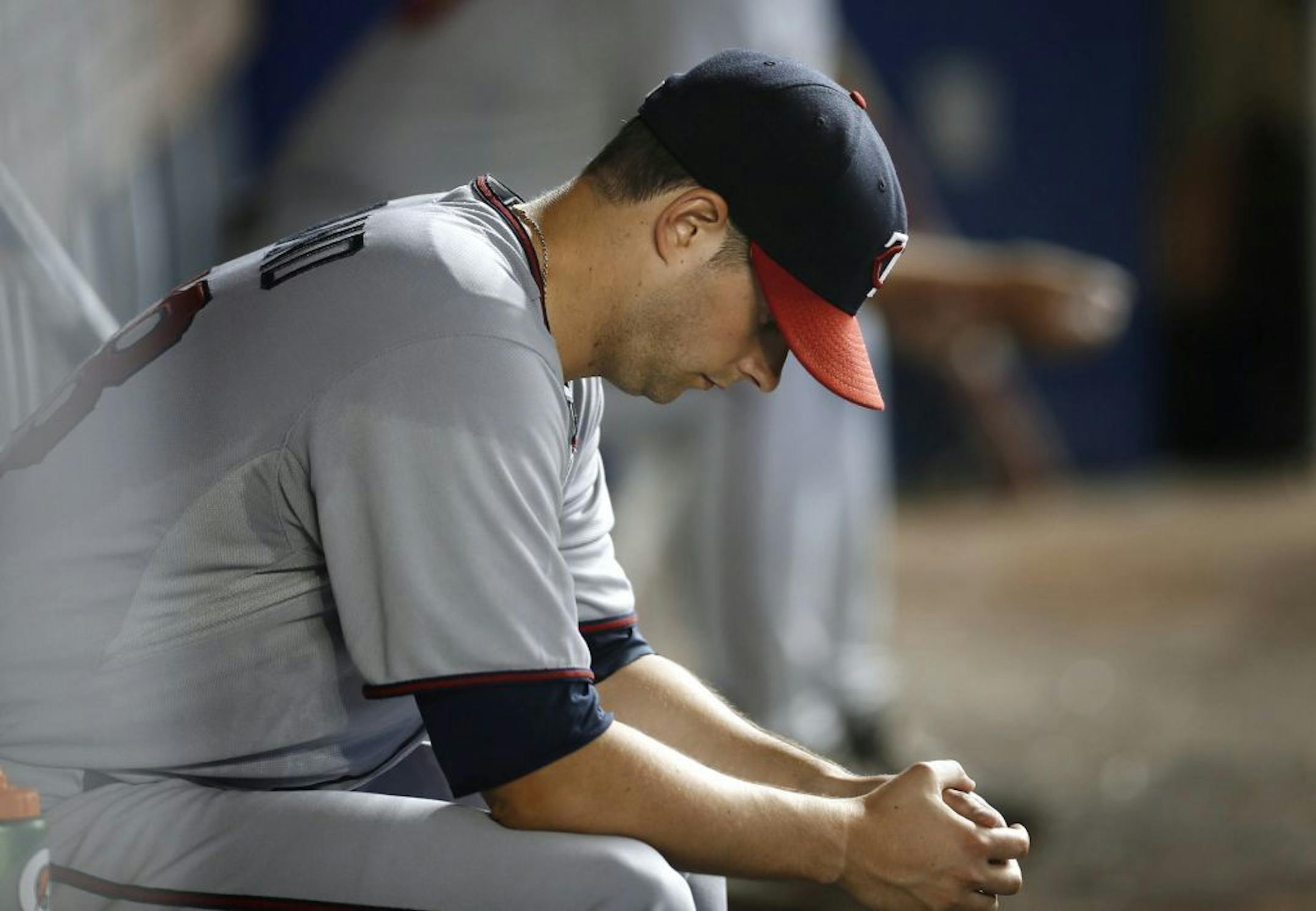 Twins starter Scott Diamond sits in the dugout during the seventh inning of a game against the Miami Marlins, Wednesday, June 26, 2013, in Miami. The Marlins won 5-3.
