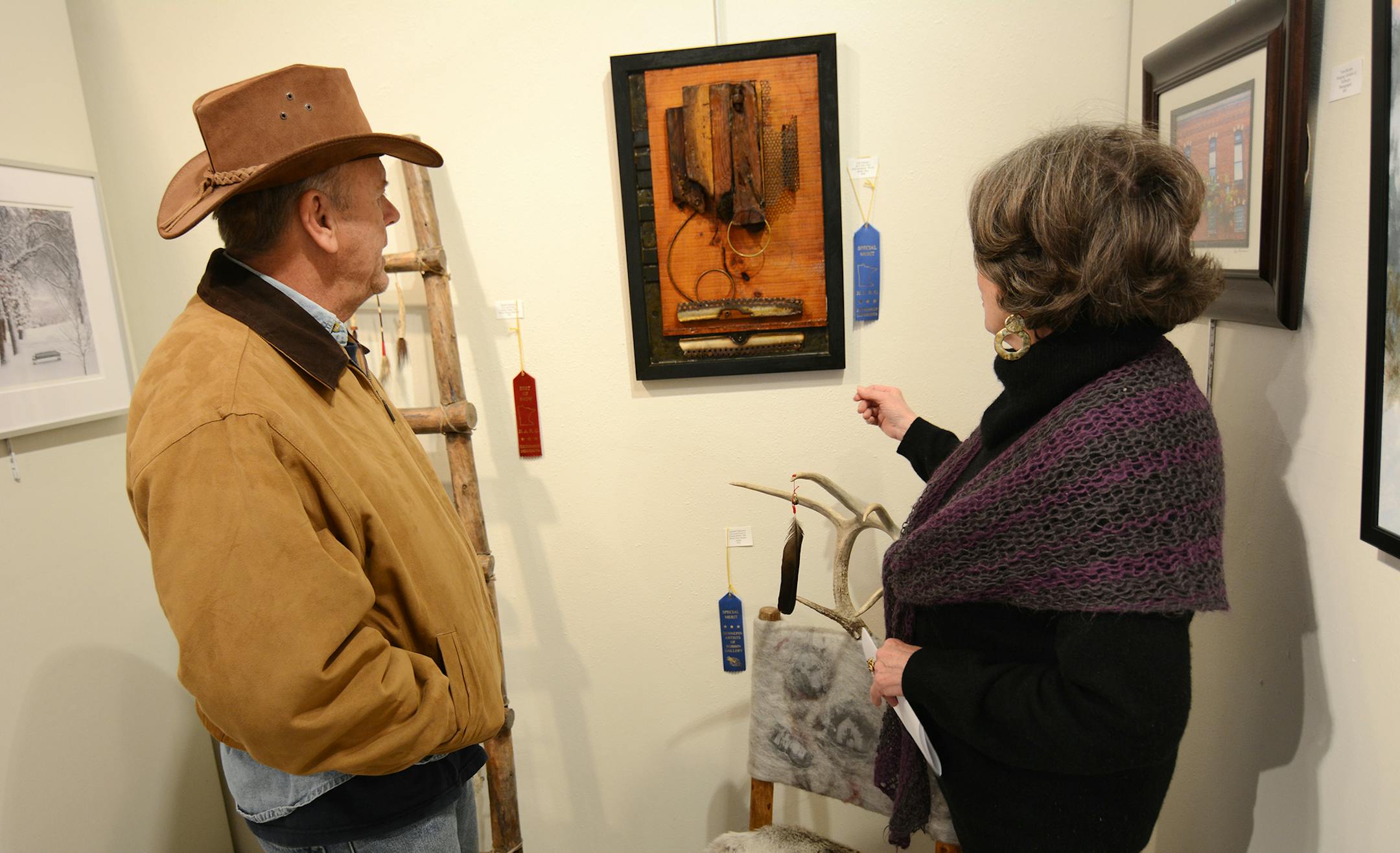 Carl Johnson&#x201a;&#xc4;&#xf4;s &#x201a;&#xc4;&#xfa;All in Due Time&#x201a;&#xc4;&#xf9; received a merit award at the &#x201a;&#xc4;&#xfa;Extremely Minnesota&#x201a;&#xc4;&#xf9; show at the Robbin Gallery in Robbinsdale. Johnson (left) works primarily with found objects, and for this piece, he used pieces of a catalytic converter. He also used a piece of wood that he found in the river that "must have been in there 100 years,&#x201a;&#xc4;&#xf9; he said. &#x201a;&#xc4;&#xfa;It was just beautif