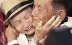 South Korean Lee Keum-seom, 92, left, weeps with her North Korean son Ri Sang Chol, 71, during the Separated Family Reunion Meeting at the Diamond Mou