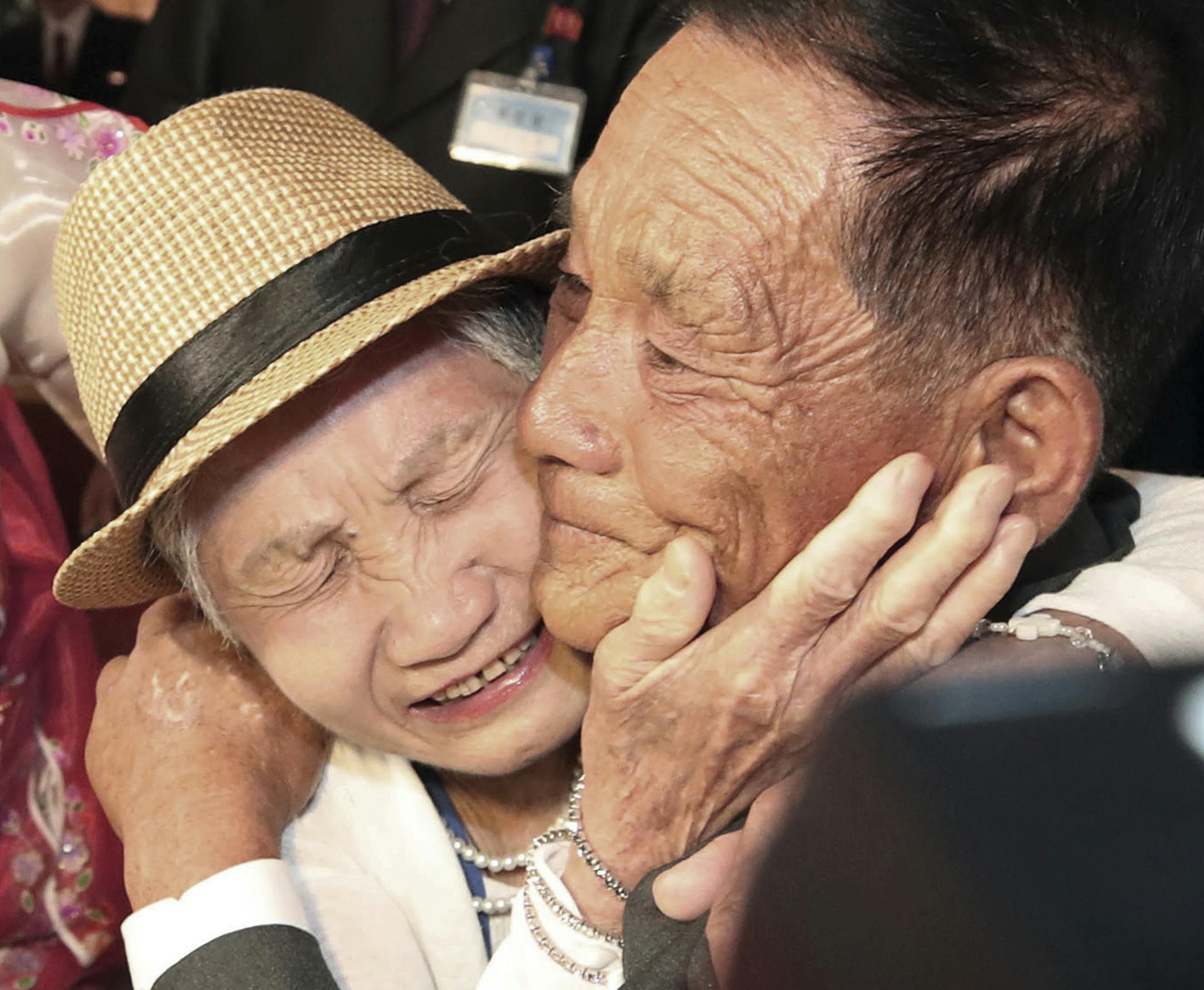 South Korean Lee Keum-seom, 92, left, weeps with her North Korean son Ri Sang Chol, 71, during the Separated Family Reunion Meeting at the Diamond Mountain resort in North Korea, Monday, Aug. 20, 2018. Dozens of elderly South Koreans crossed the heavily fortified border into North Korea on Monday for heart-wrenching meetings with relatives most haven't seen since they were separated by the turmoil of the Korean War. (Lee Ji-eun/Yonhap via AP)