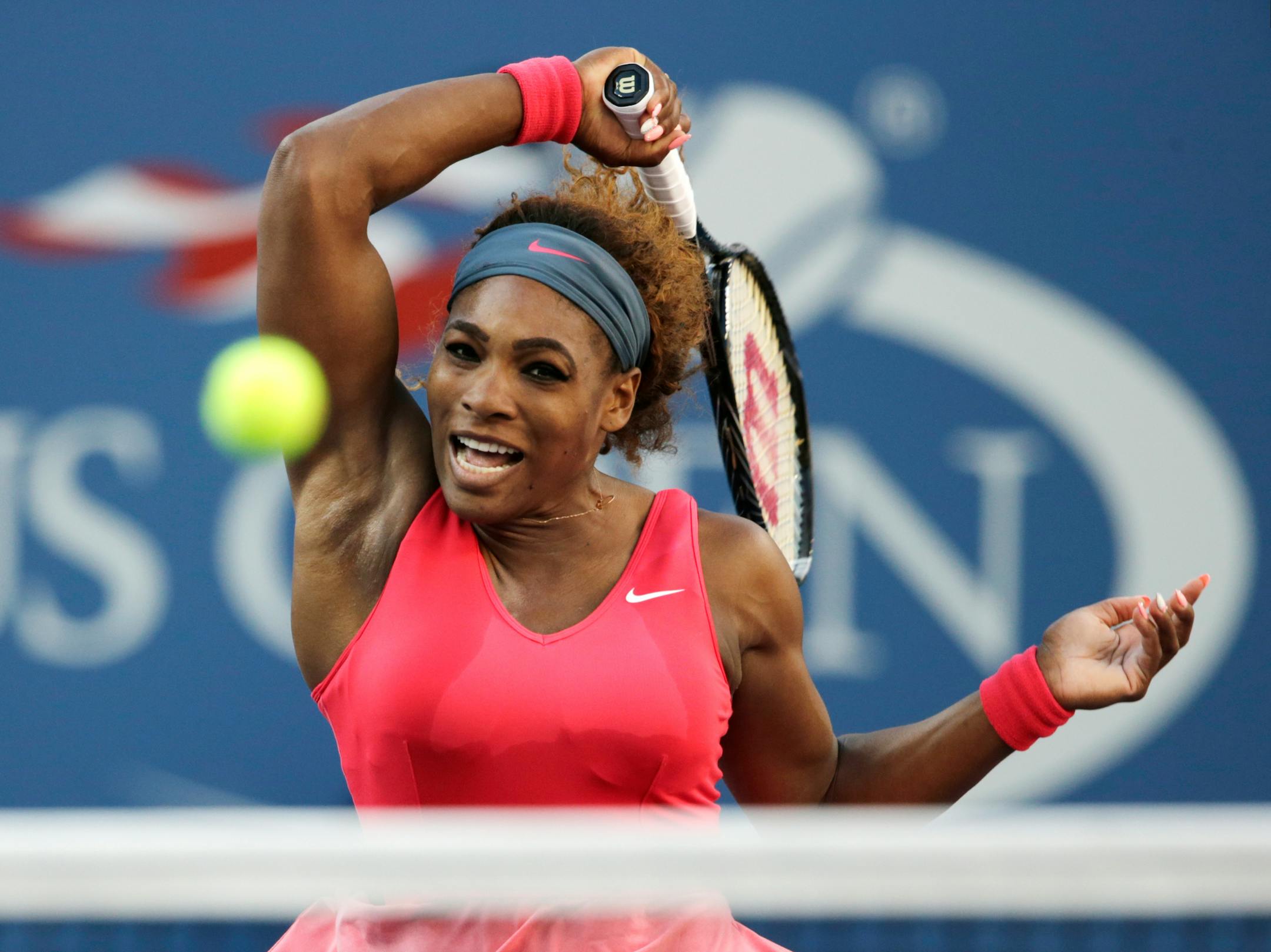 In this Sept. 8, 2013, photo, Serena Williams returned a shot to Victoria Azarenka during the women's singles final of the U.S. Open tennis tournament. Williams is the Associated Press' 2013 Female Athlete of the Year, easily winning a vote by news organizations.