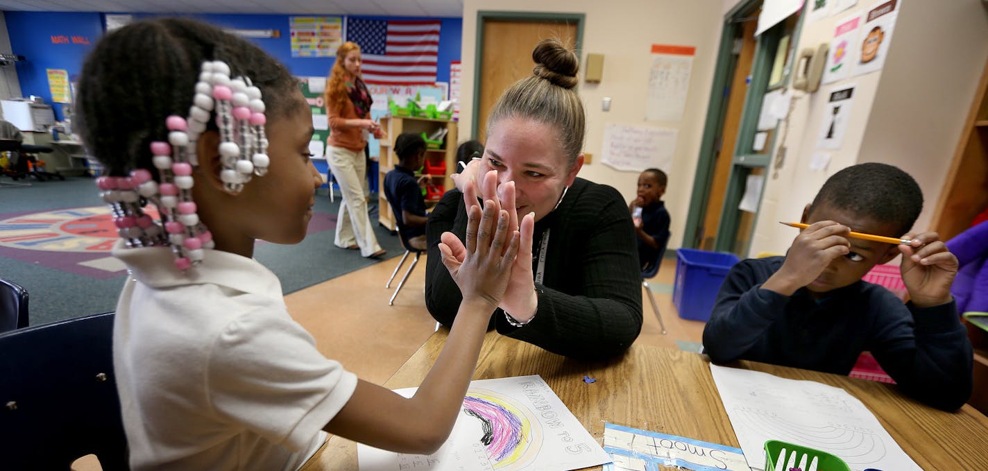 Lucy Laney School Principal Maurie Melander visited with kindergarten students Jayla Solomon, left, and Daniel Smoot, Monday, March 17, 2014 in Minneapolis, MN. ] (ELIZABETH FLORES/STAR TRIBUNE) ELIZABETH FLORES &#x2022; eflores@startribune.com