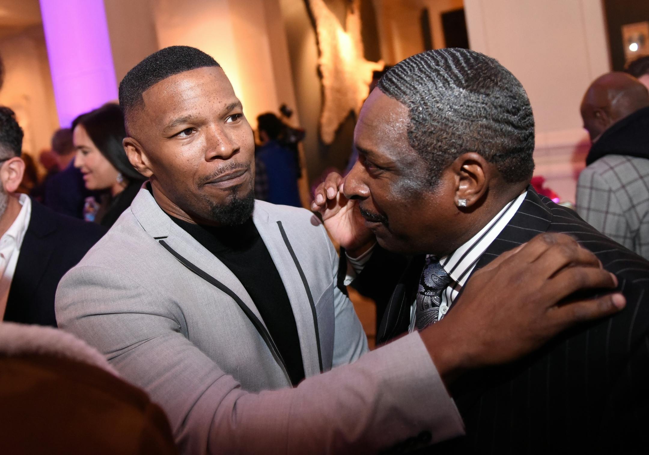 Jamie Foxx patted the shoulder of Gregory Reid, of St. Paul, as Foxx made his way through the party Saturday night in Edina.