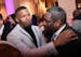 Jamie Foxx patted the shoulder of Gregory Reid, of St. Paul, as Foxx made his way through the party Saturday night in Edina.