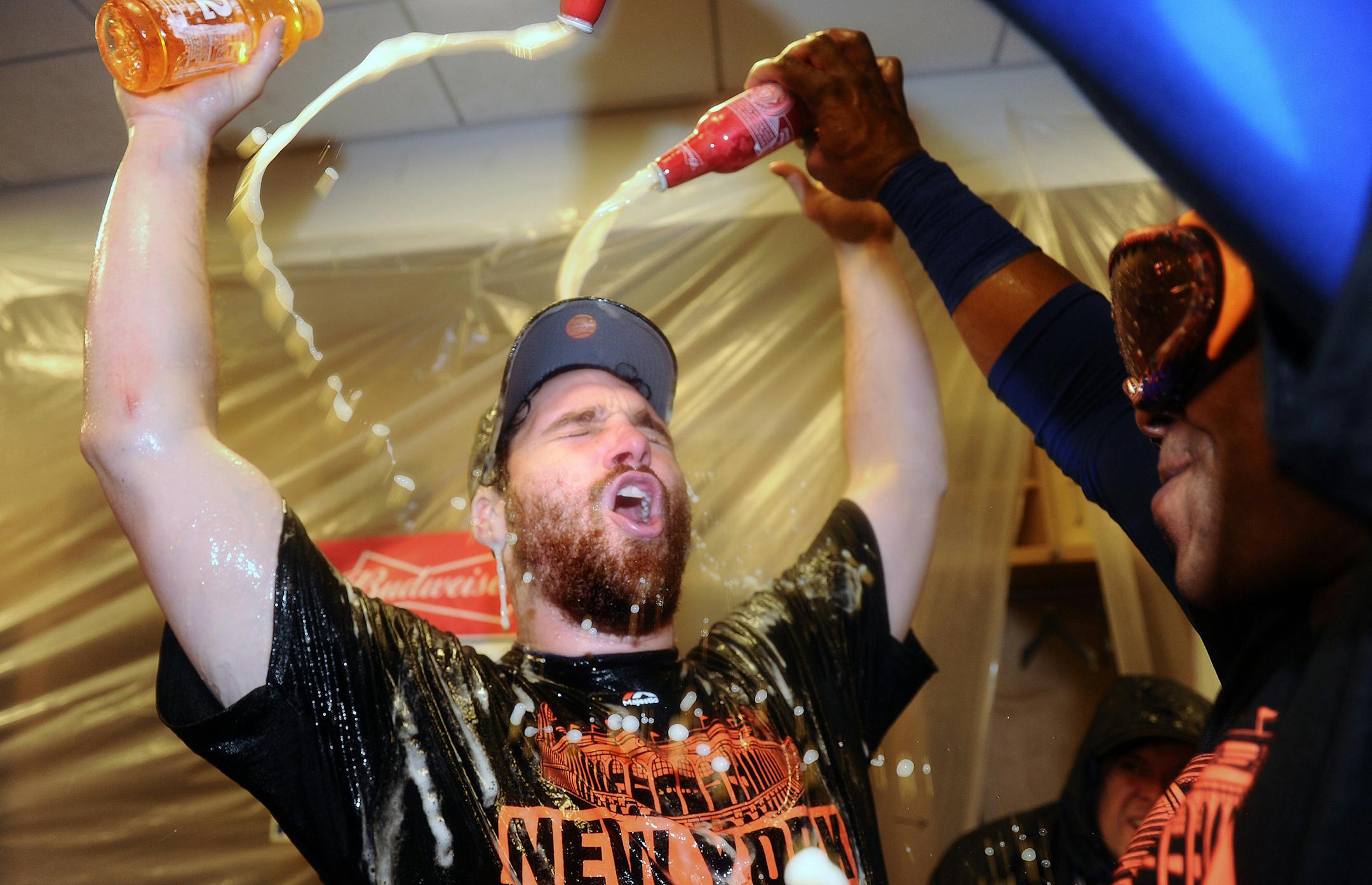 The Mets' Daniel Murphy celebrated in the locker room after a 3-2 series-clinching win against the Los Angeles Dodgers in Game 5 of the NLDS on Thursday. Murphy hit the go-ahead homer in the sixth inning.