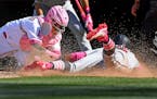 Angels catcher Martin Maldonado tagged out the Twins' Ehire Adrianza trying to score in the ninth inning Sunday.
