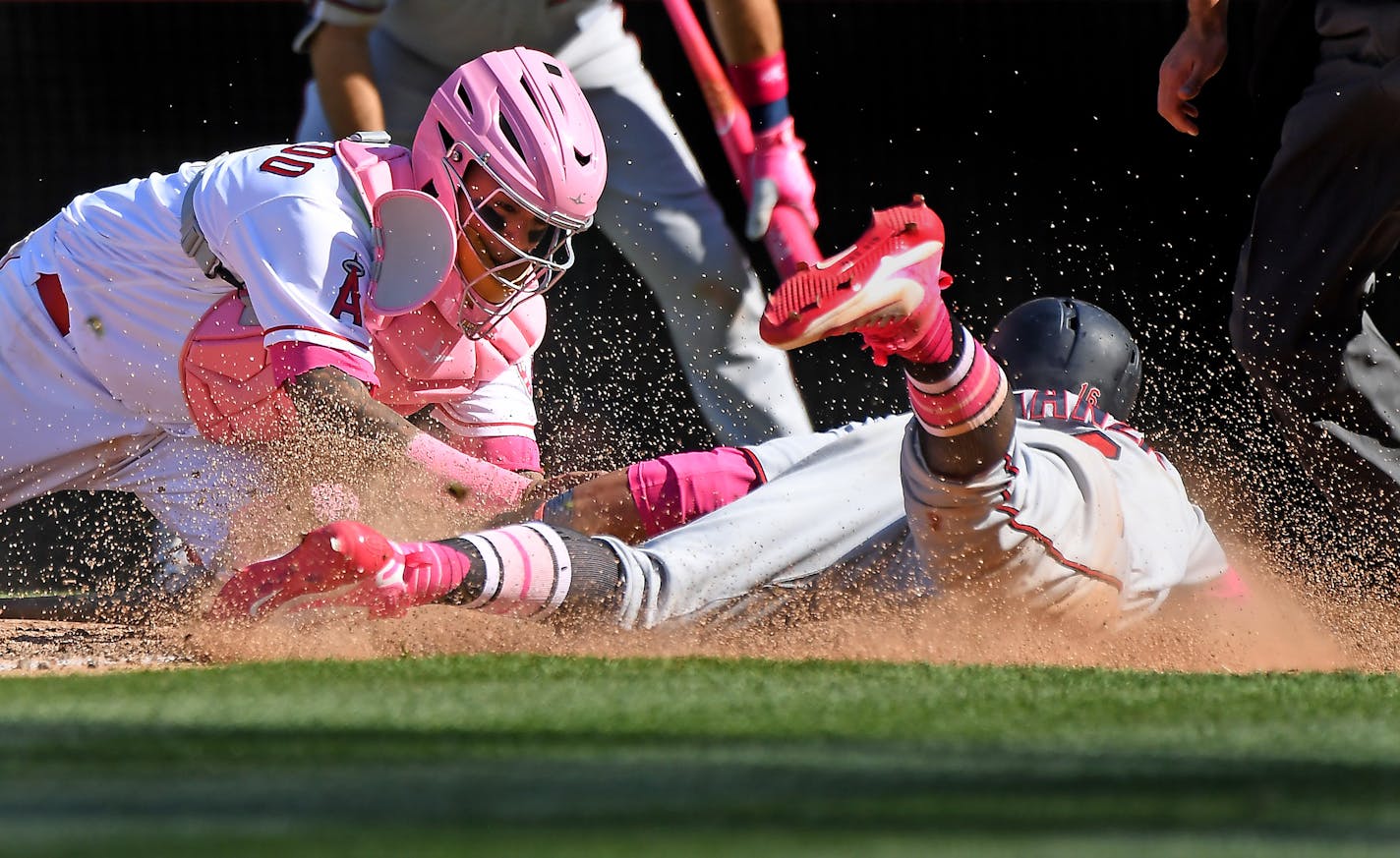 Angels catcher Martin Maldonado tagged out the Twins' Ehire Adrianza trying to score in the ninth inning Sunday.