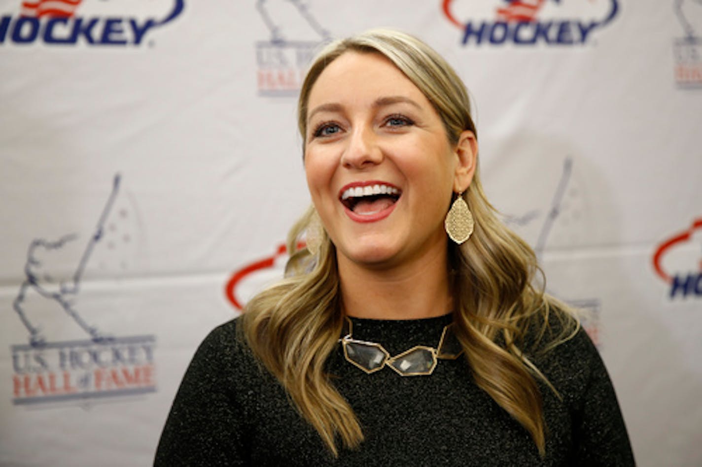 Olympic medalist Krissy Wendell speaks with members of the media before being inducted into the U.S. Hockey Hall of Fame, Thursday, Dec. 12, 2019, in Washington. (AP Photo/Patrick Semansky)