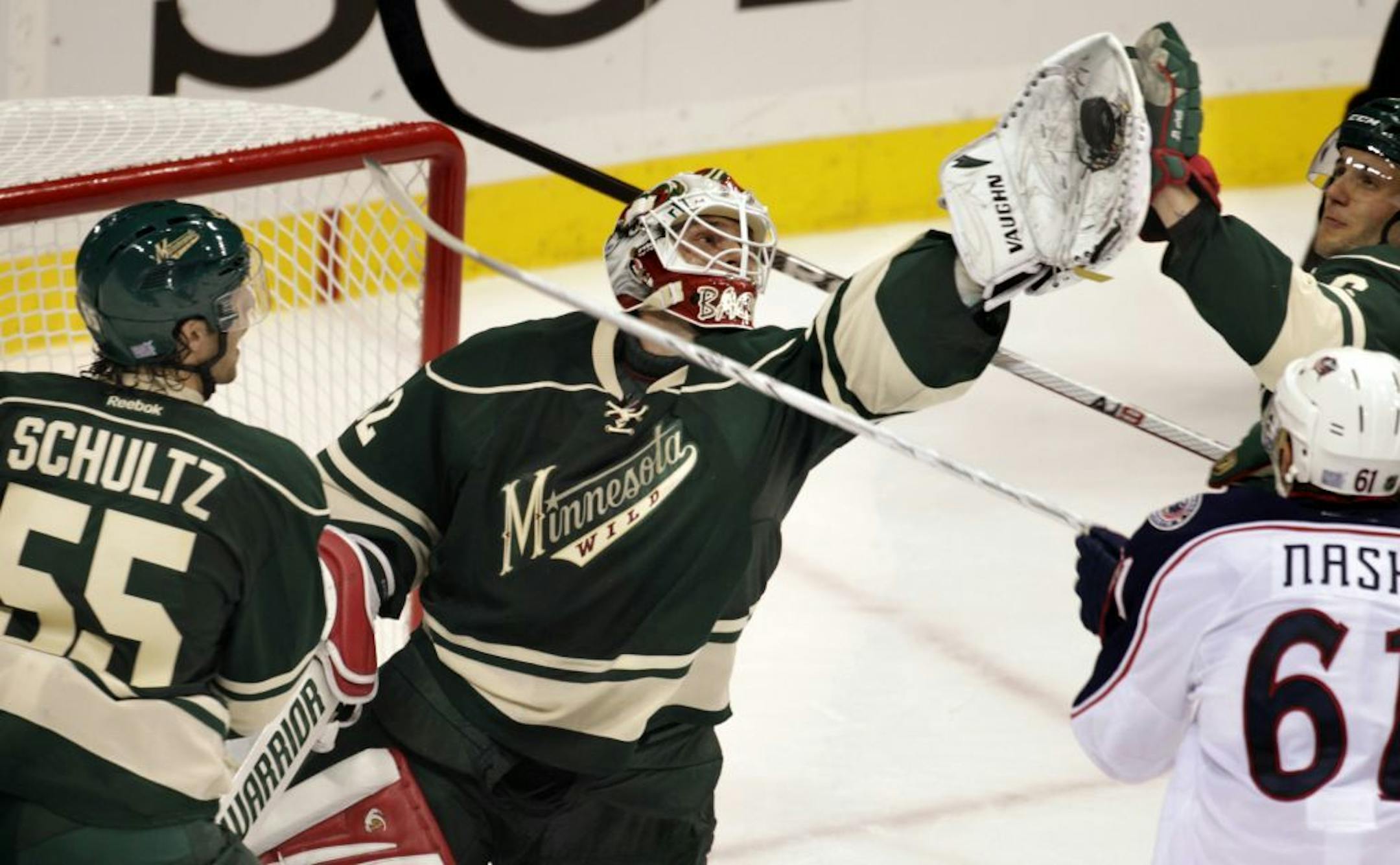 TOM WALLACE • twallace@startribune.com _ The Wild Home opener at the Xcel Center vs the Columbus Blue Jackets. NIKLAS BACKSTROM Stops a wild puck in front of his goal in the second period of the Wild Home opener. [ _ Assignments #20019855E_ October 8, 2011_ SLUG: wild1009_ EXTRA INFORMATION: Name(CQ) from the mom.