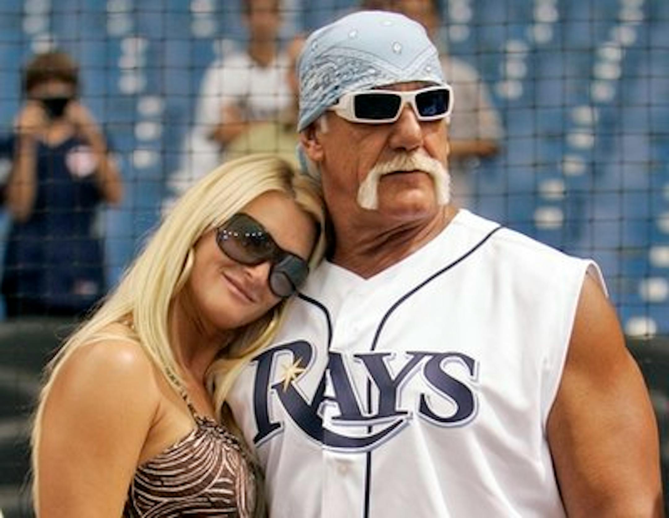 FILE - In this Sept. 3, 2008 file photo, restler Hulk Hogan, right, and his then girlfriend, Jennifer McDaniel, watch the New York Yankees take batting practice before a baseball game against the Tampa Bay Rays in St. Petersburg, Fla. The celebrity wrestler and McDaniel were married at Hogan's Clearwater Beach home Tuesday, Dec. 14, 2010, during a small, private ceremony, his attorney said. (AP Photo/Chris O'Meara, File)