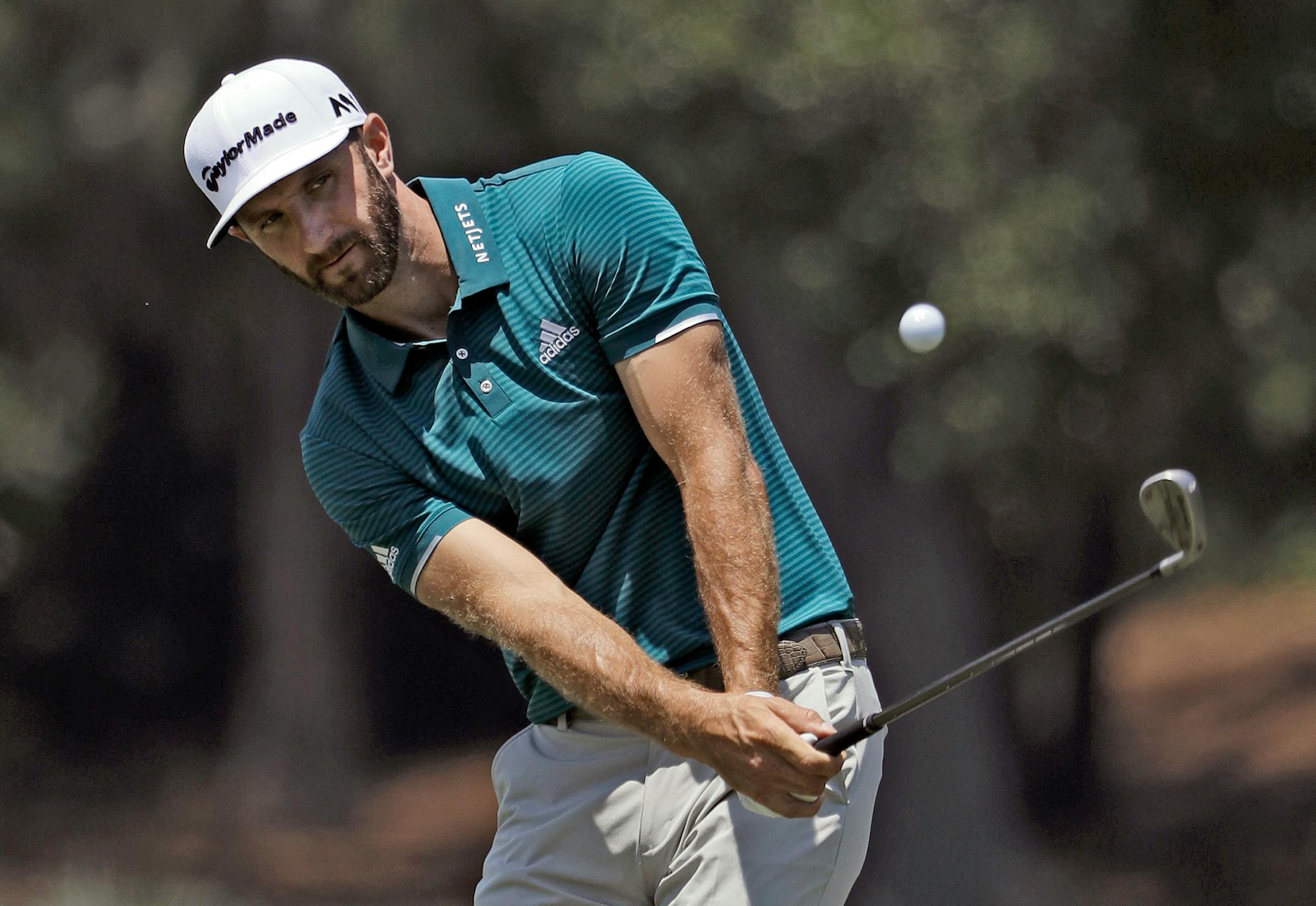 Dustin Johnson chipped onto the seventh green during a practice round for The Players Championship on Wednesday. Johnson has not finished better than 28th in the event.
