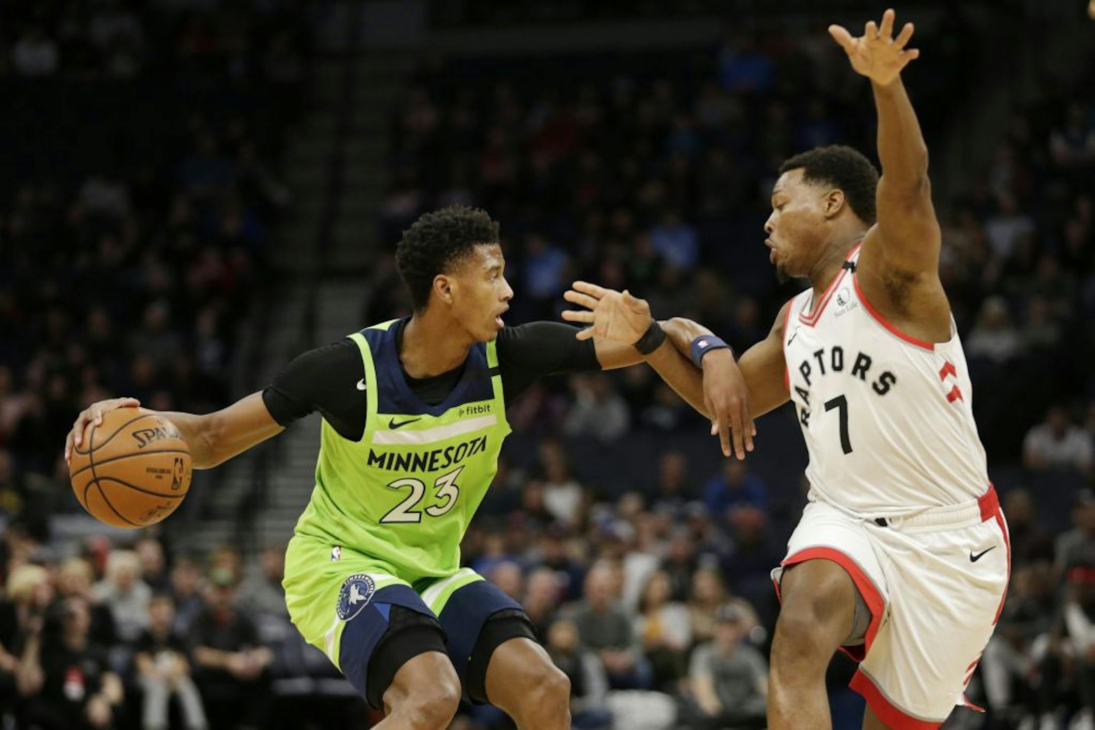Minnesota Timberwolves guard Jarrett Culver (23) drives against Toronto Raptors guard Kyle Lowry (7) in the first quarter of an NBA basketball game Saturday, Jan. 18, 2020, in Minneapolis.