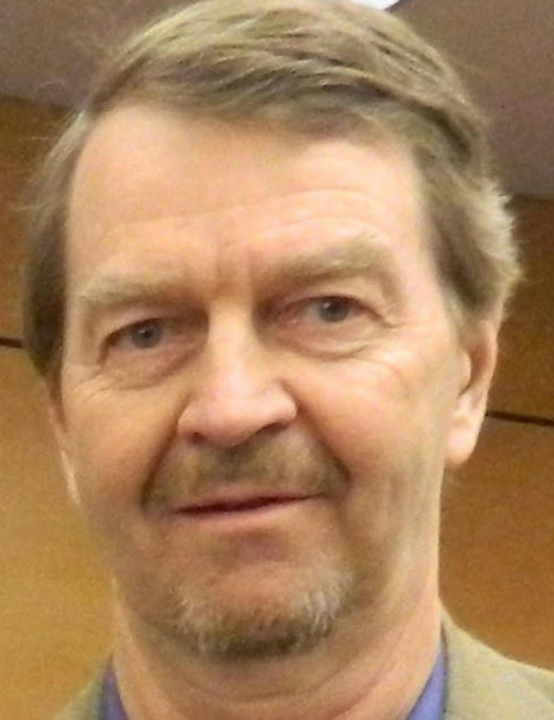 Commissioner Ted Bearth, left, with Pam and Larry Hall.