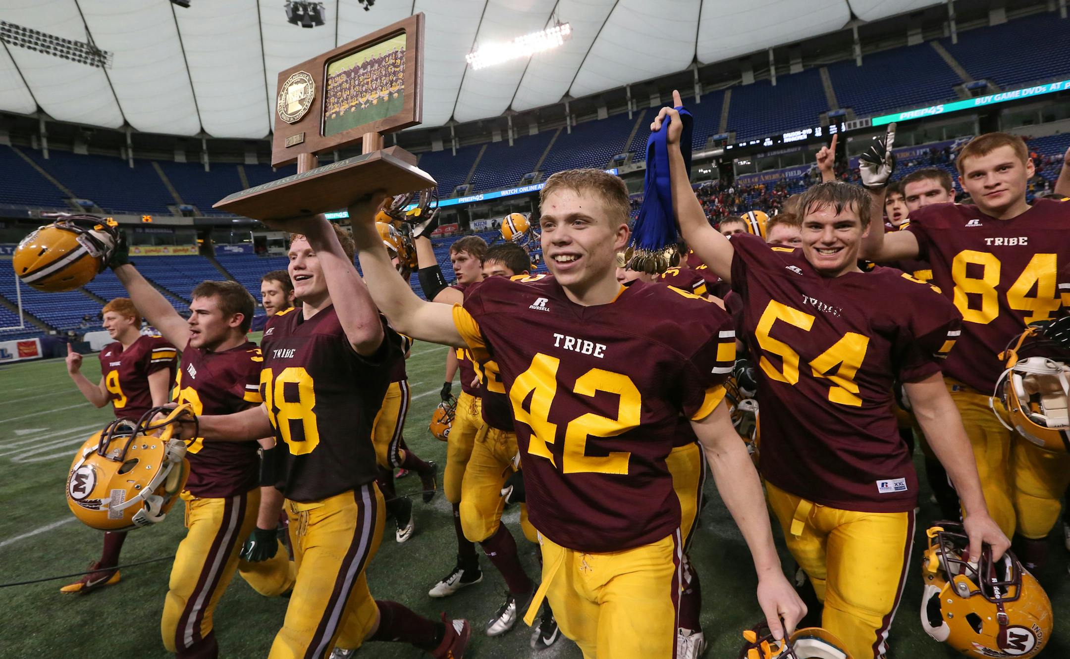Minnesota State High School League Prep Bowl Championship Games, Metrodome, 11/30/13. Dawson-Boyd vs. Mahnomen, Class 1A Championship. (left to right) Mahnomen celebrated their championship win over Dawson-Boyd.] Bruce Bisping/Star Tribune bbisping@startribune.com