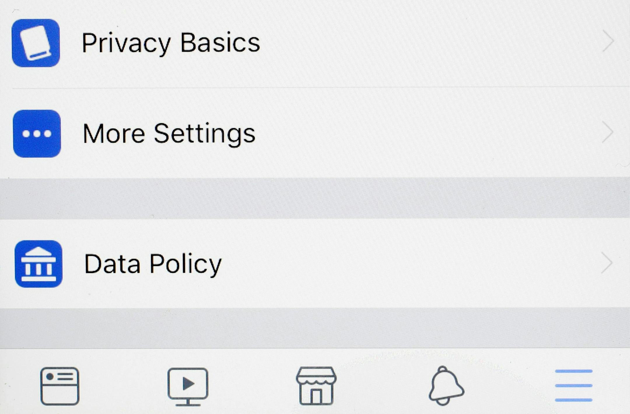 Tabs on a Facebook app for, "Privacy Basics, More Settings, and Data Policy," are displayed on an iPhone, Monday, April 9, 2018, in New York. Facebook is in full damage-control mode following revelations that it might have shared the data of some 87 million users with Cambridge Analytica. Starting Monday Facebook will let users know if their data was shared, and some 2.2 billion Facebook users will be given access to a link to see what apps they use and what information they shared with those ap