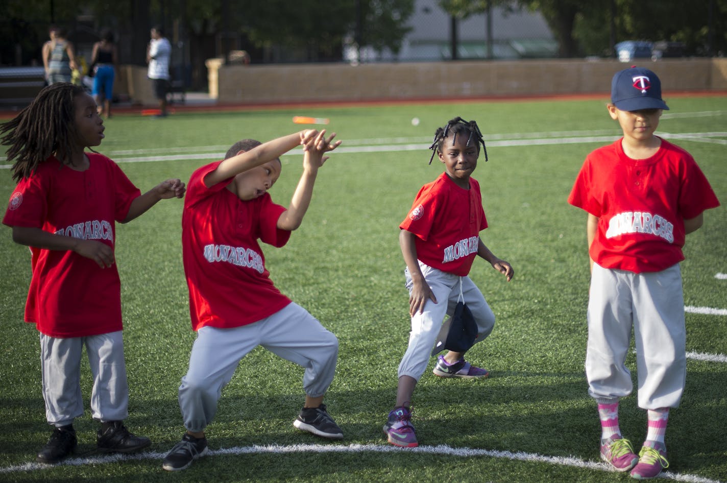 Zytavius, left of center, and Ja&#x2019;Kiya, showed off their dance moves as Malachi, far left and Breeze looked on during a coach pitch Monarchs practice at Farview Park in late May.