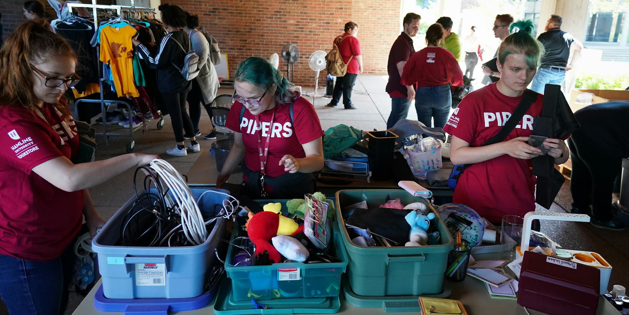 Hamline University students browsed through dorm items during the school's "free store" event outside Bush Memorial Library on Tuesday, Sept. 3, 2019. ] Shari L. Gross ¥ shari.gross@startribune.com Twin Cities colleges have found a way to reuse all the stuff kids threw out at the end of the year -- by collecting it and offering it in "Free Stores" when back-to-school time comes around again. Hamline's pop-up free store happened on Sept 3, giving out used clothing, linens, dorm ware and furn