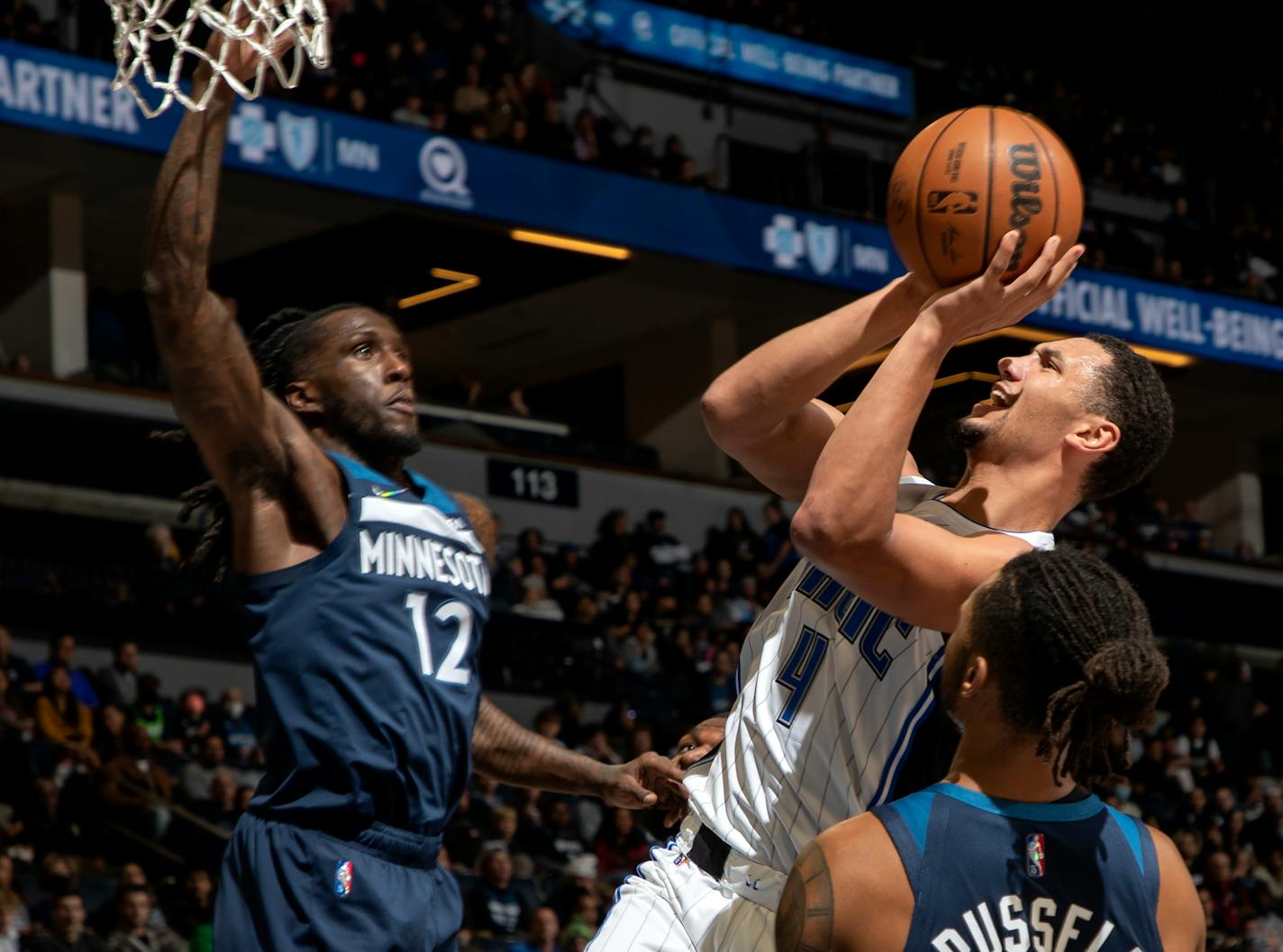 Jalen Suggs (4) of the Orlando Magic attempts a shot while defended by Taurean Prince (12) of the Minnesota Timberwolves in the first quarter, Monday, Nov. 1 at Target Center in Minneapolis, Minn. The Minnesota Timberwolves hosted the Orlando Magic at Target Center. ] CARLOS GONZALEZ • cgonzalez@startribune.com