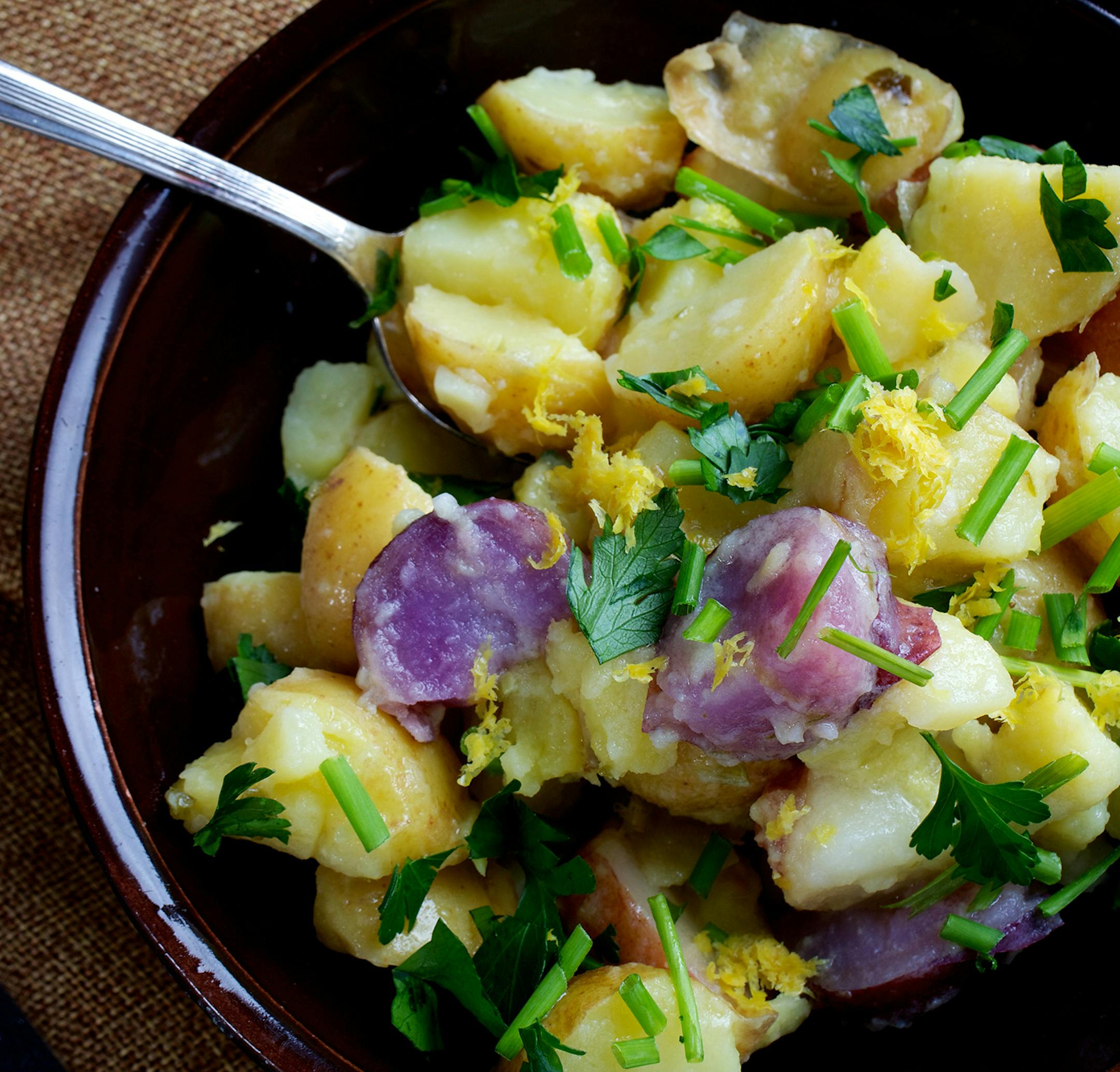 Creating potato salads that are the always-welcome-at-a-party side dish. Here, Lemon, Garlic and Chili Potato Salad. Illustrates POTATOSALAD (category d), by Bonnie S. Benwick (c) 2015, The Washington Post. Moved Thursday, May 28, 2015. (MUST CREDIT: Photo for The Washington Post by Deb Lindsey)