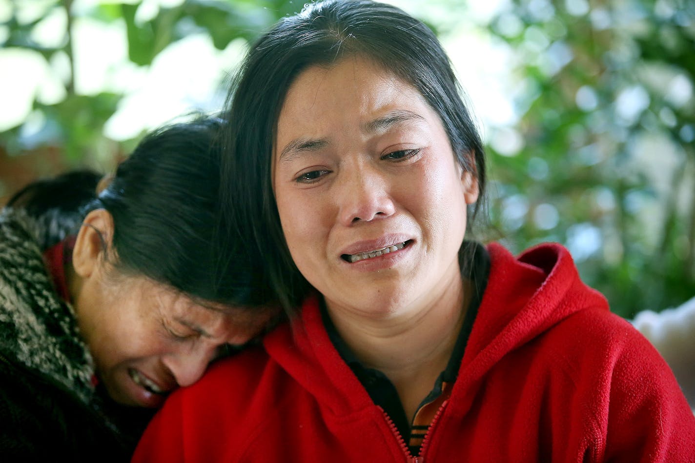 Chanry Soeng, the wife and mother of the fire victims wept at an uncle's home as she talked about her family, Wednesday, October 14, 2015 in South St. Paul. Her friend Saly Som was there by her side.