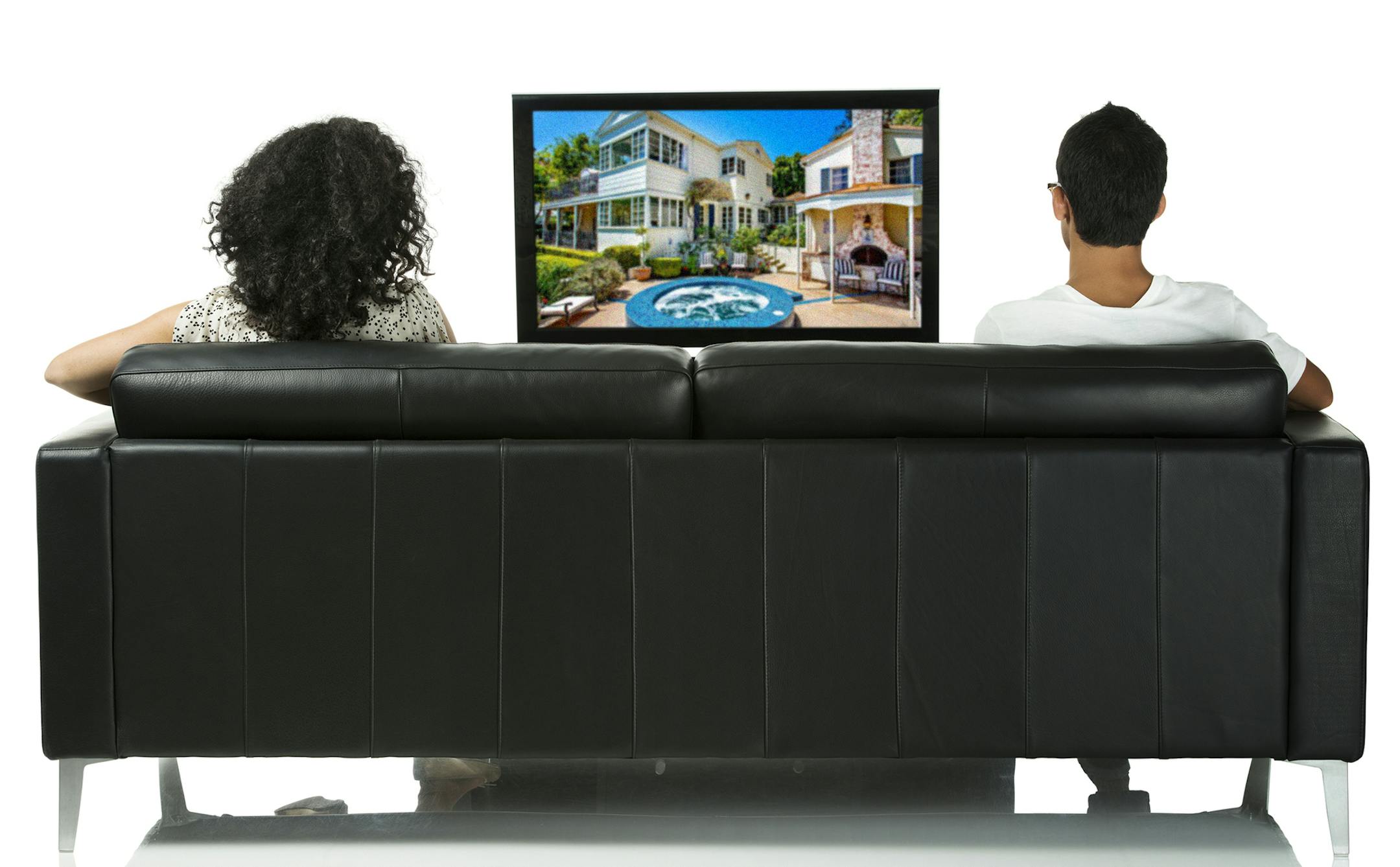 Rear view of couple watching televisionhttp://www.twodozendesign.info/i/1.png