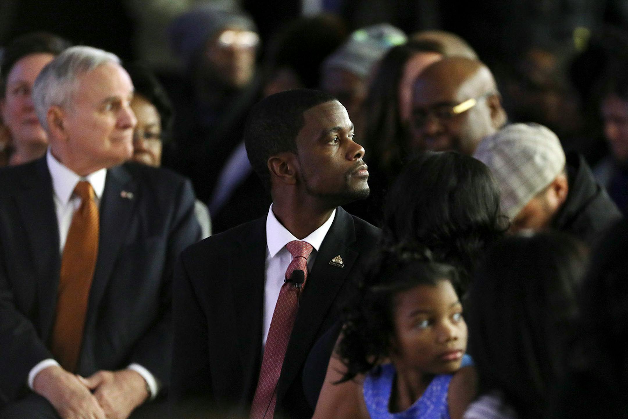 Gov. Mark Dayton and Melvin Carter watched as a group of dancers from the Ain Dah Yung Center performed during Carter's swearing in ceremony as St. Paul mayor.