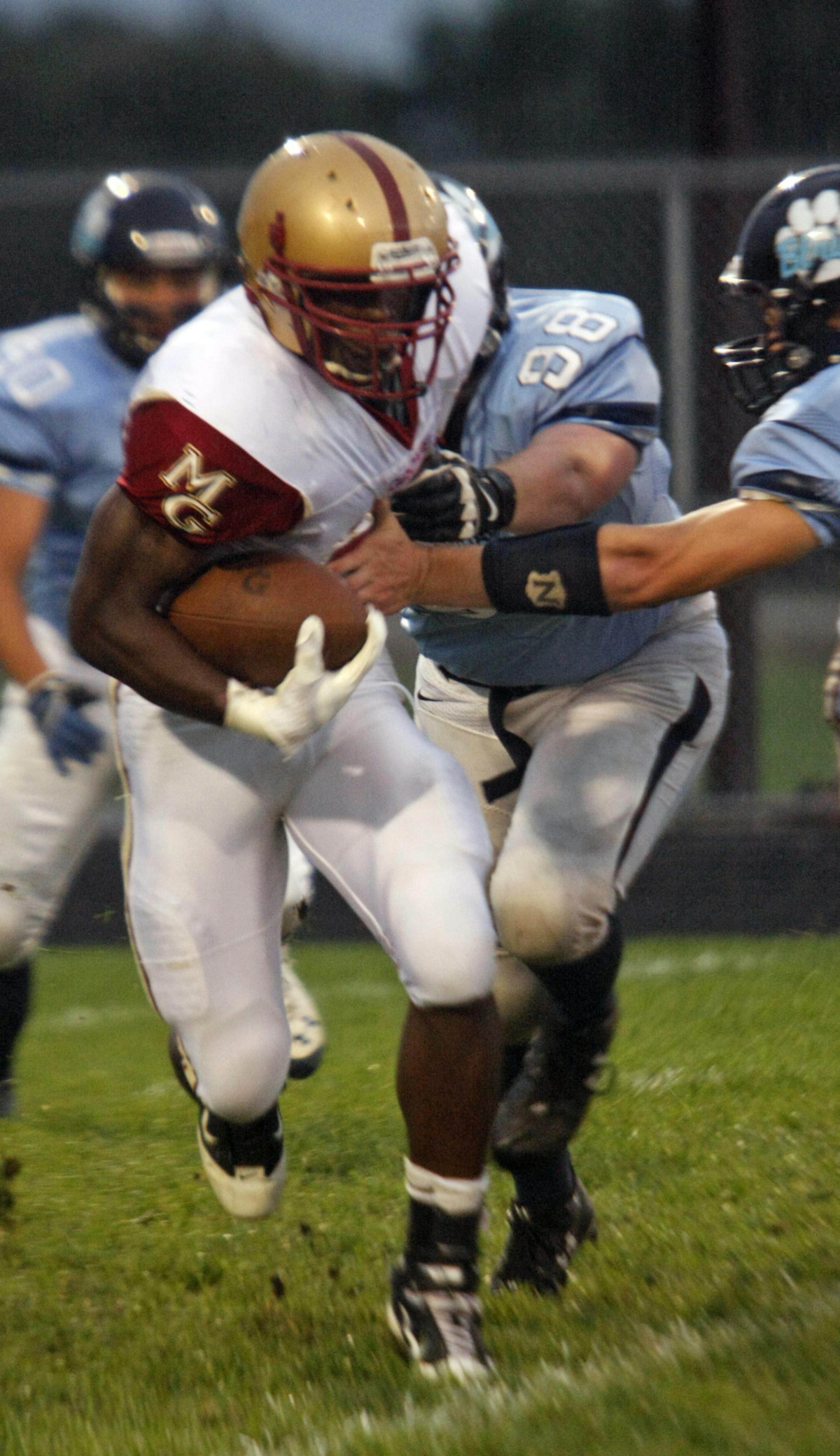 Maple Grove Crimson running back Tahi Nomane carries the ball during the first half of he Crimson's game against Blaine at Blaine High School on Friday night. ] Chris Kelleher, Special to the Star Tribune, 9/20/2013, Blaine, MN.