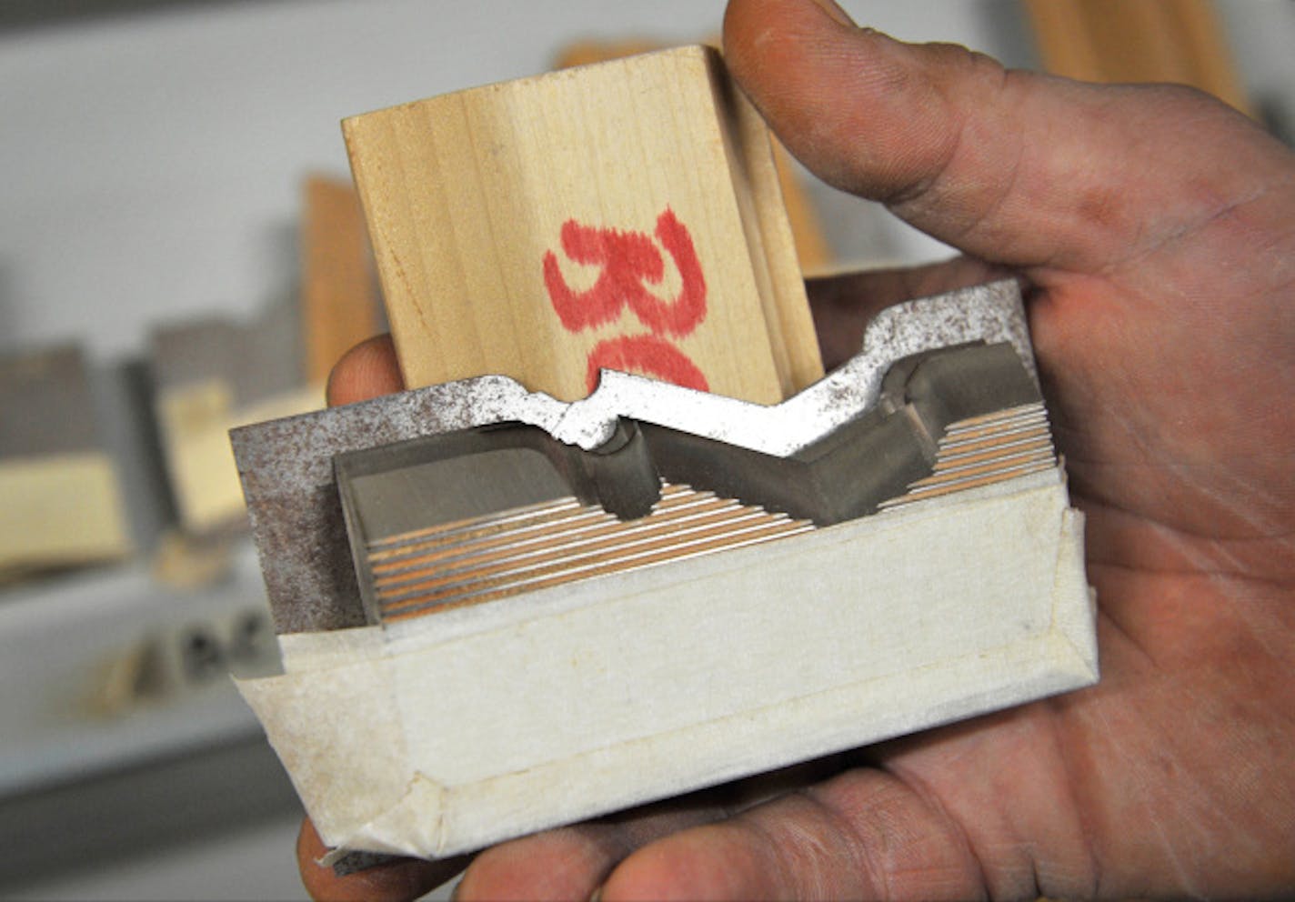 Mark Aune, owner of A&A Millwork in Minneapolis, showed off one of more than 5,000 custom-made blades the company uses to create the numerous varieties of moulding offered by the wood-products company.