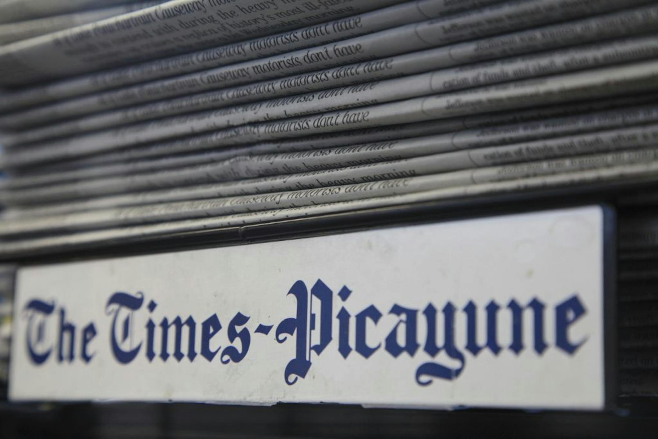 A New Orleans Times-Picayune newspaper stand at a gas station in New Orleans, May 24, 2012. The newspaper confirmed on Thursday that it would cut back its print publishing schedule to three days a week and lay off an unknown number of staff members.