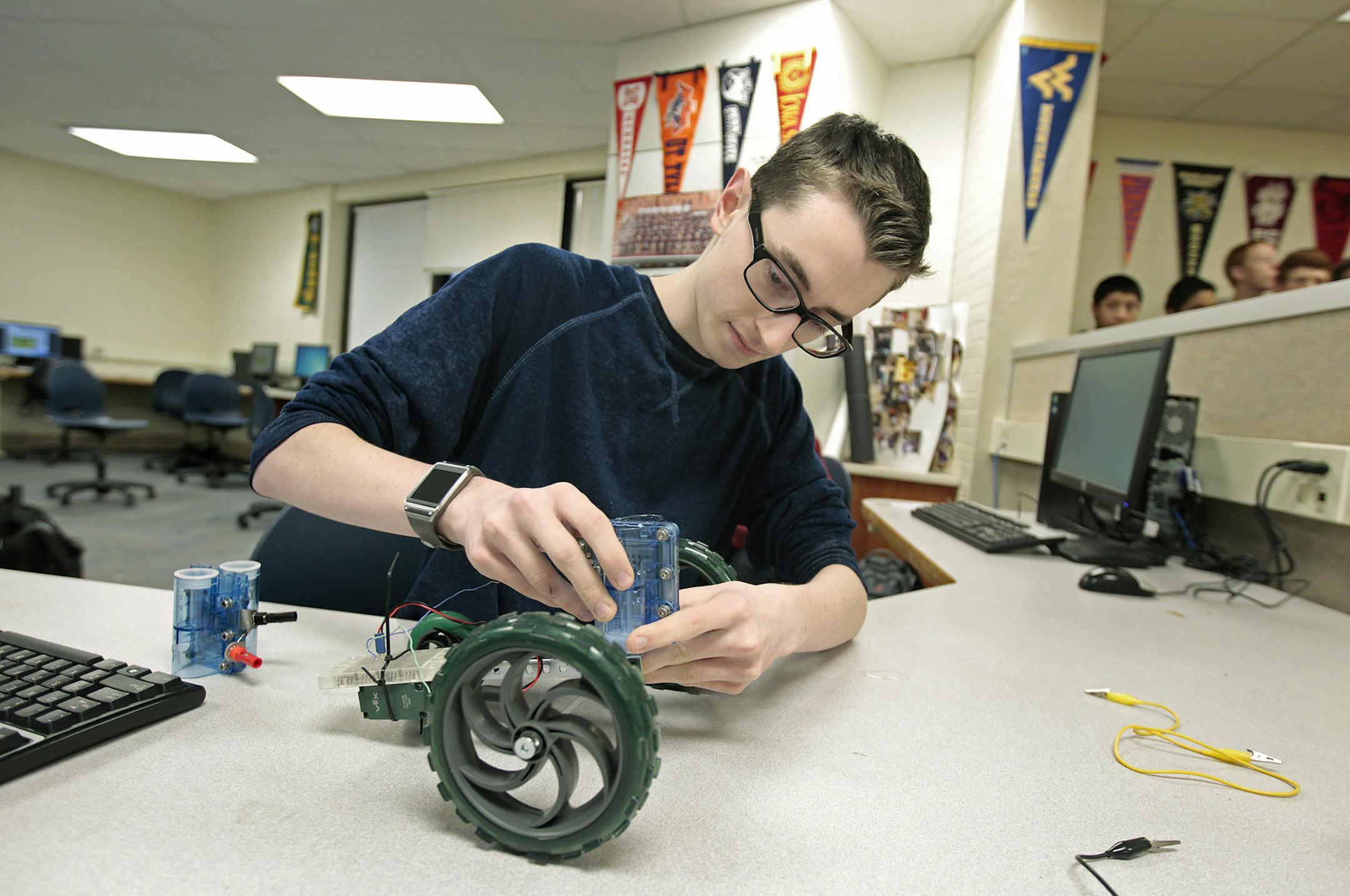 Osseo High School senior Nathan Limmer, 18, worked on a hydrogen fuel cell, during the "Project Lead the Way" class, at Osseo High, Monday, December 8, 2014 in Osseo, MN. The school's two-year-old "Project Lead the Way," STEM program, has earned national certification. ] (ELIZABETH FLORES/STAR TRIBUNE) ELIZABETH FLORES &#x2022; eflores@startribune.com